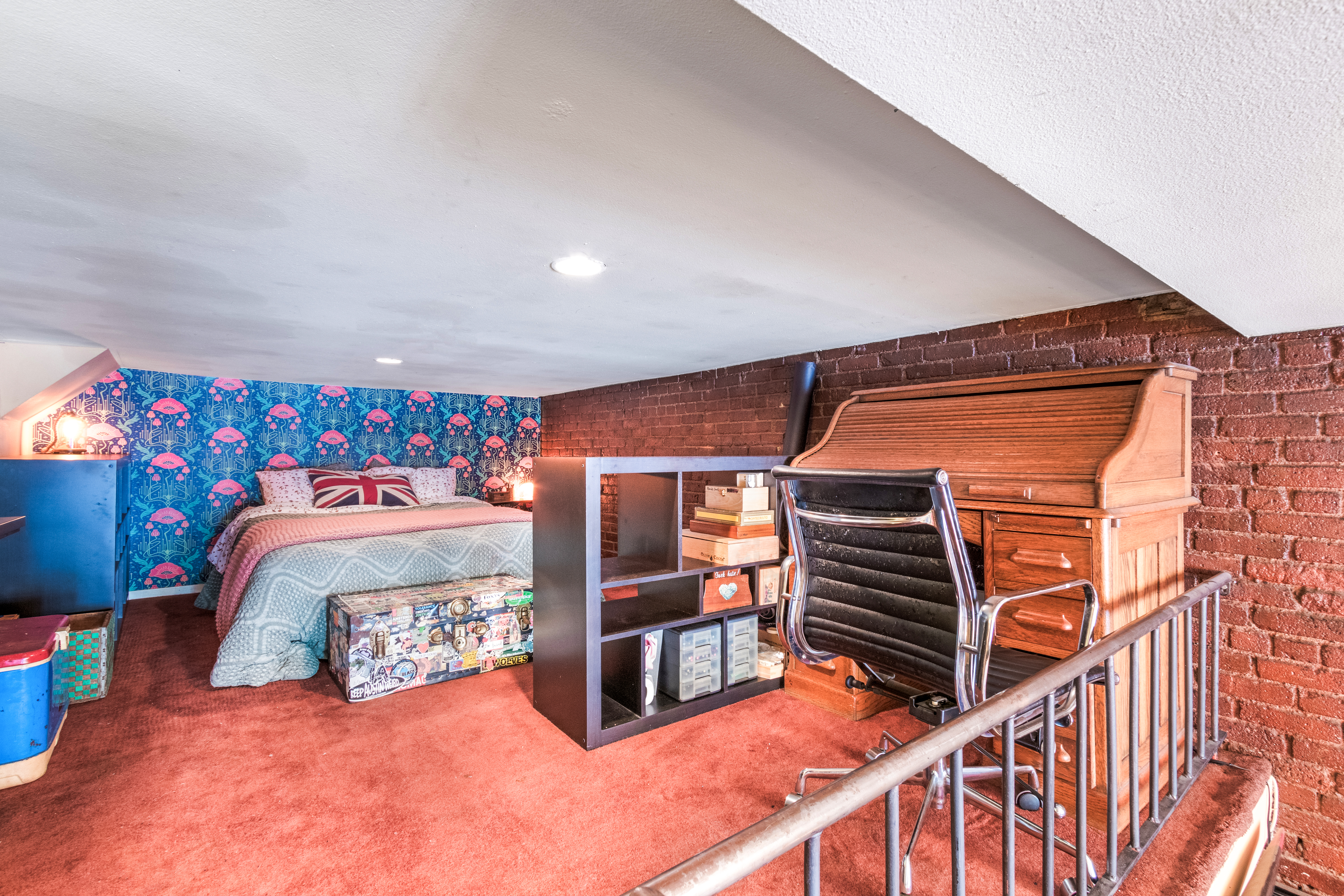 324 Pearl Street, Unit 1F Manhattan, NY 10038 - Photo 8 of 12 a room with stairs and a bed