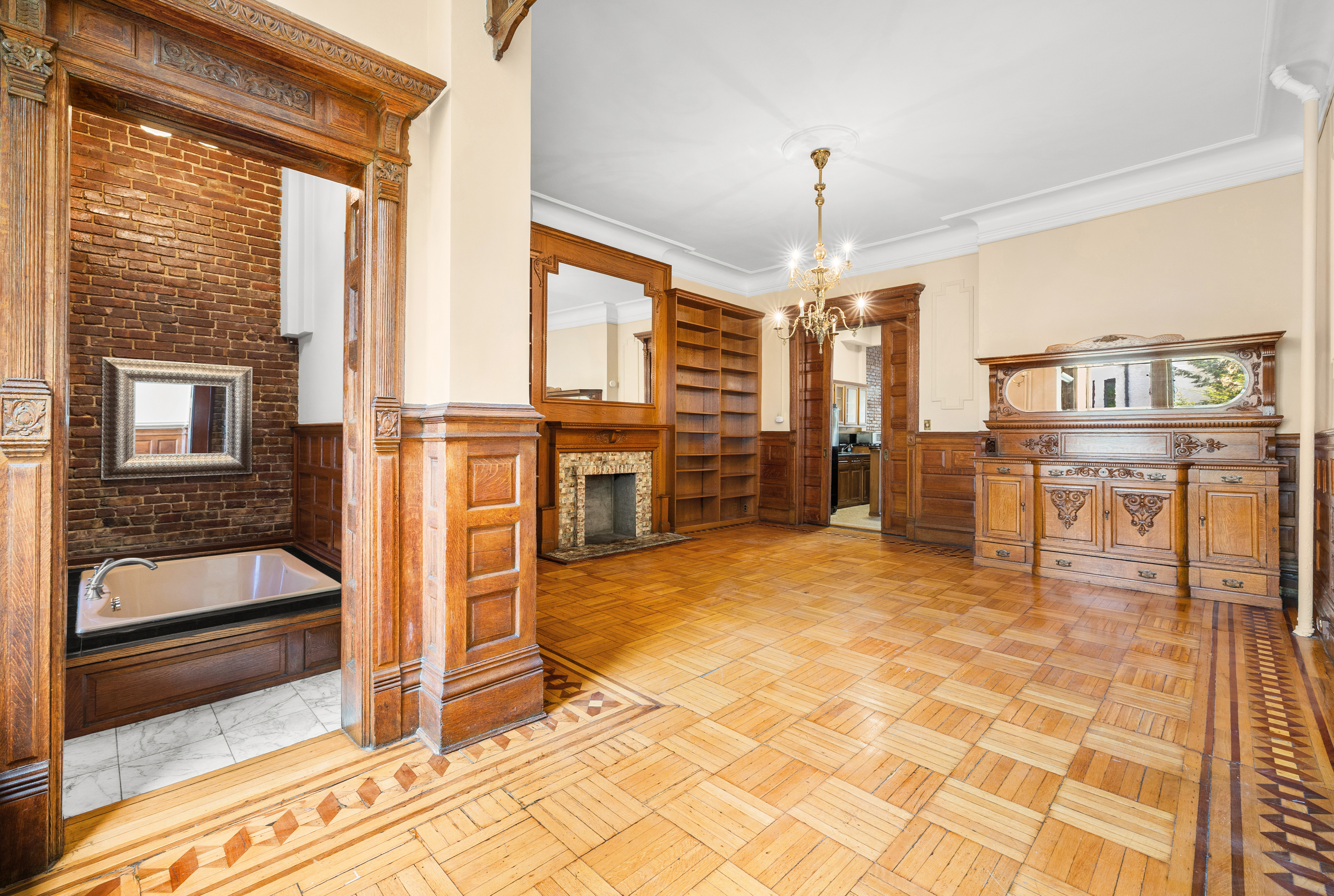 154 West 77th Street, Unit #1 Manhattan, NY 10024 - Photo 8 of 10 a view of livingroom with kitchen view and furniture