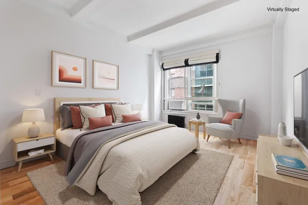 a bedroom with a bed and a couch