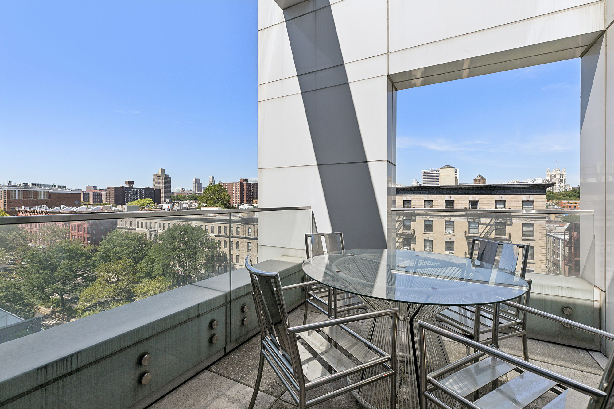 2351 Adam Clayton Powell Jr Boulevard, Unit PH23 Manhattan, NY 10030 - Photo 4 of 9 a view of a balcony with chairs