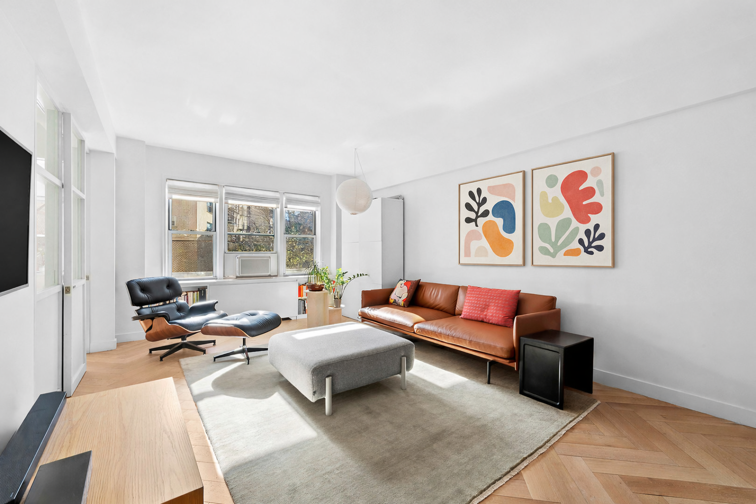 34 Plaza Street East, Unit 110 Brooklyn, NY 11238 - Photo 2 of 12 a living room with furniture and a flat screen tv