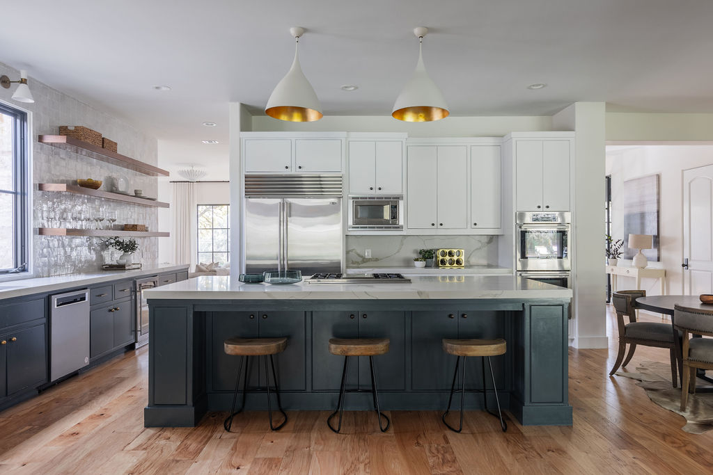 400 Inwood Road Austin, TX 78746 - Photo 12 of 43 a kitchen with stainless steel appliances granite countertop a table chairs sink and cabinets