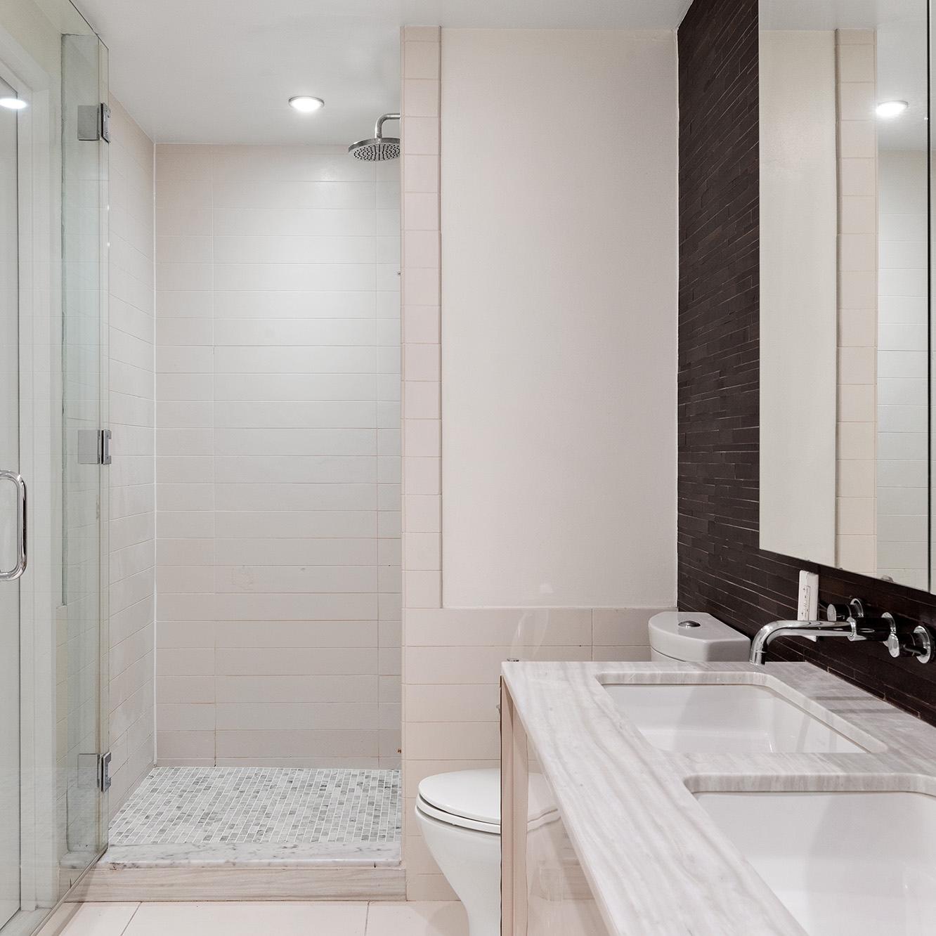 2 Northside Piers, Unit 25P Brooklyn, NY 11249 - Photo 13 of 26 a bathroom with a sink a toilet and shower