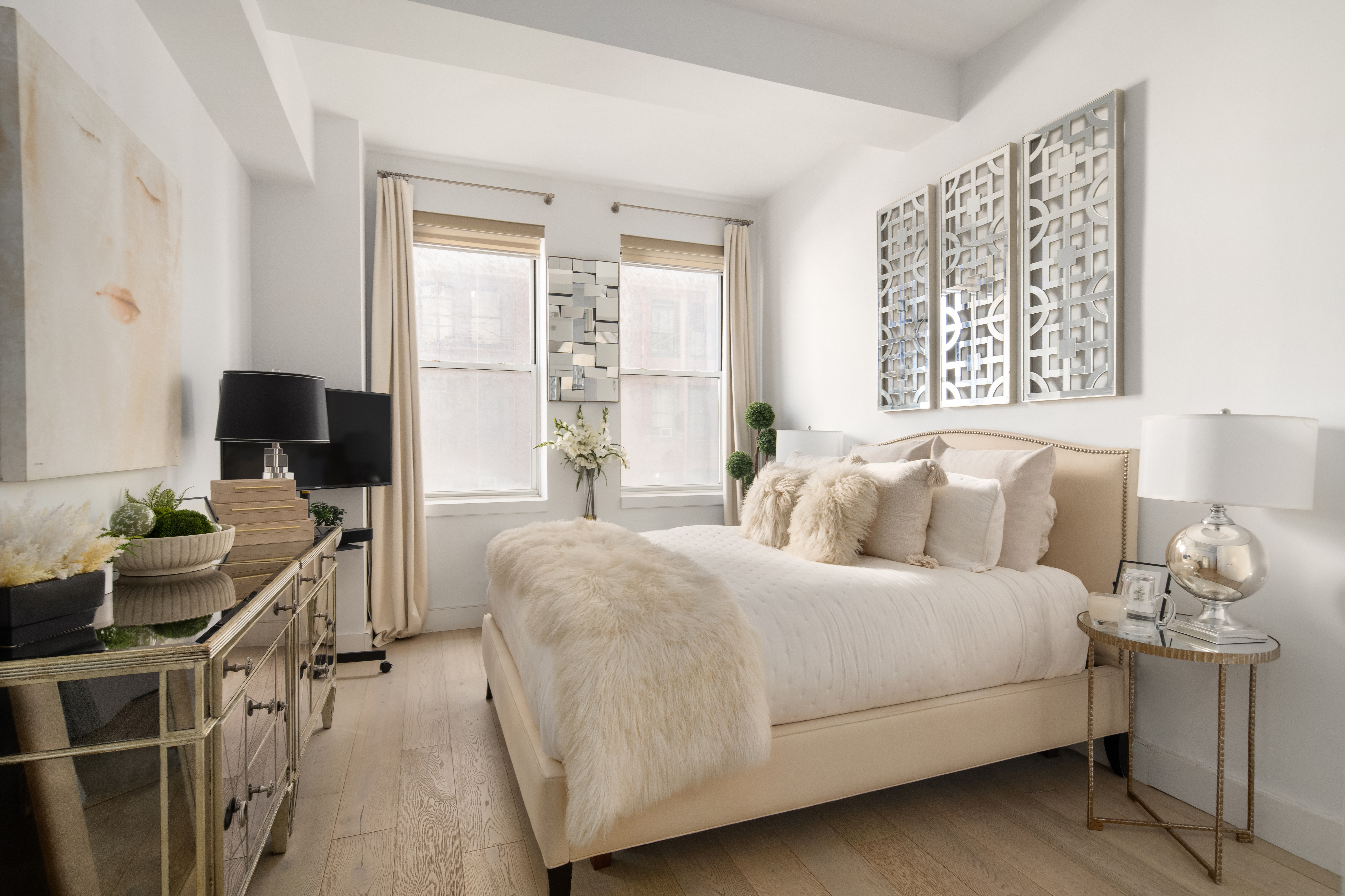 80 Chambers Street, Unit 12C Manhattan, NY 10007 - Photo 7 of 15 a bedroom with a bed and furniture