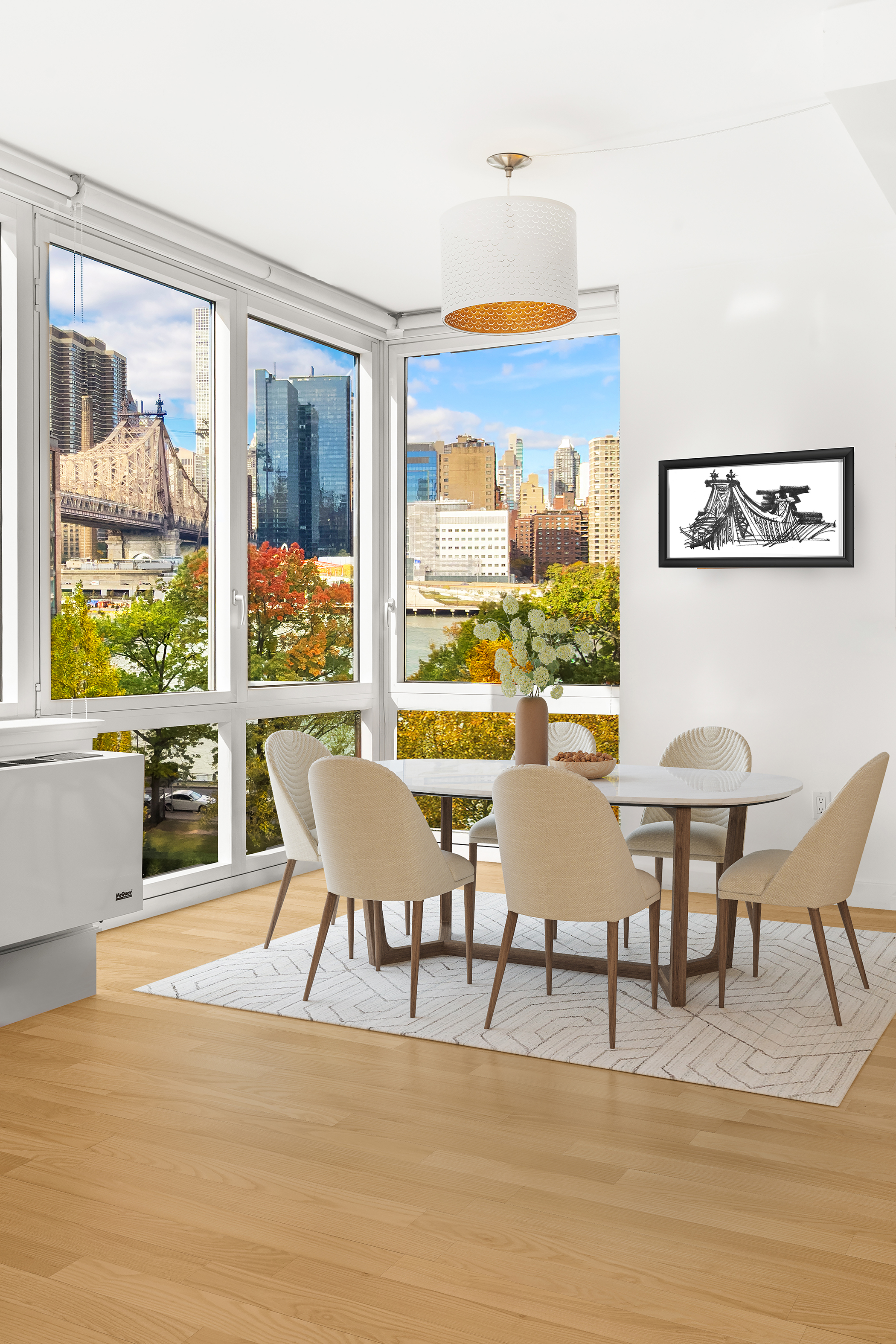 415 Main Street, Unit 7C Manhattan, NY 10044 - Photo 5 of 16 a view of a dining room with furniture large windows and wooden floor