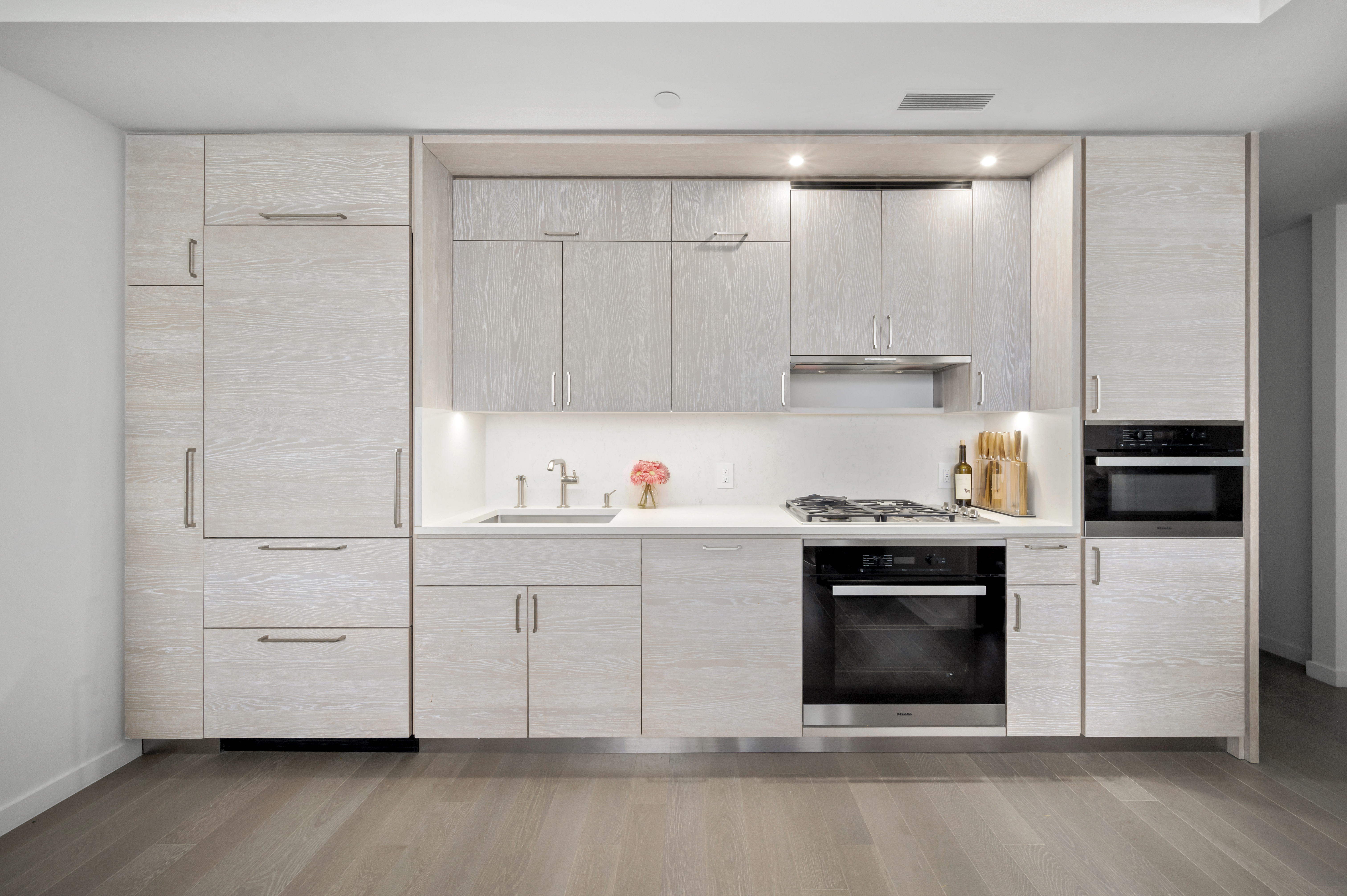 1 City Point, Unit 46F Brooklyn, NY 11201 - Photo 2 of 5 a kitchen with a sink and a stove top oven