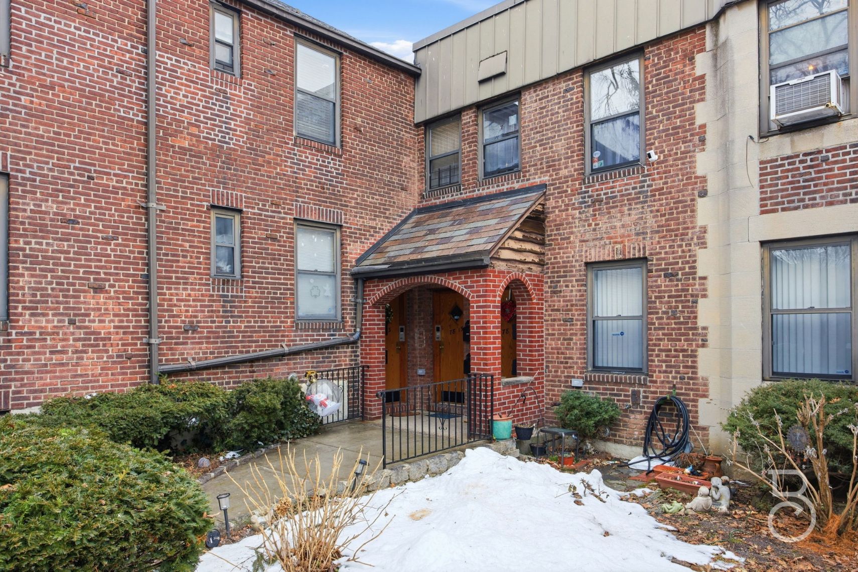 78-15 19th Drive, Unit B2 Queens, NY 11370 - Photo 17 of 17 a front view of a house with yard