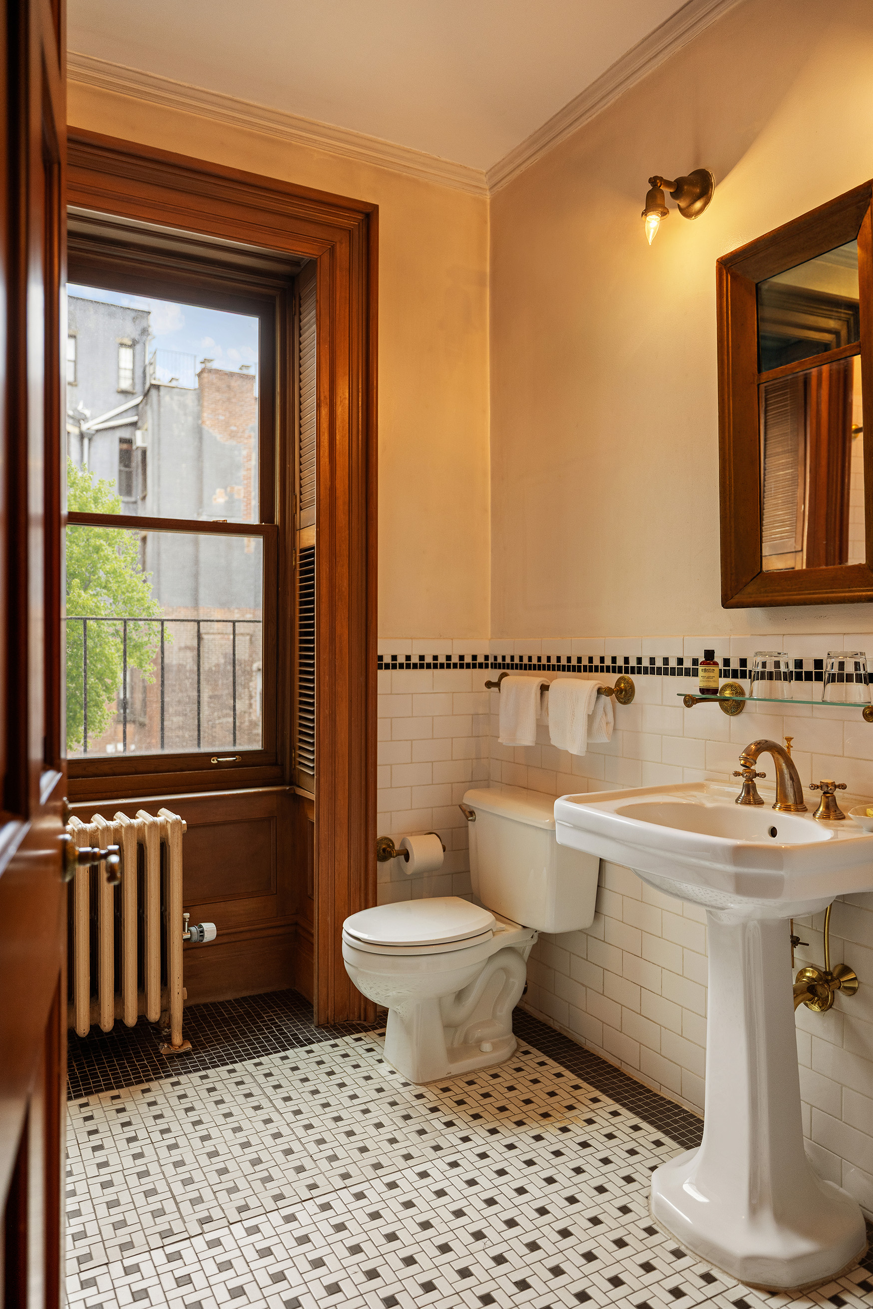 56 Irving Place, Unit 3 Manhattan, NY 10003 - Photo 5 of 11 a bathroom with a sink toilet and shower
