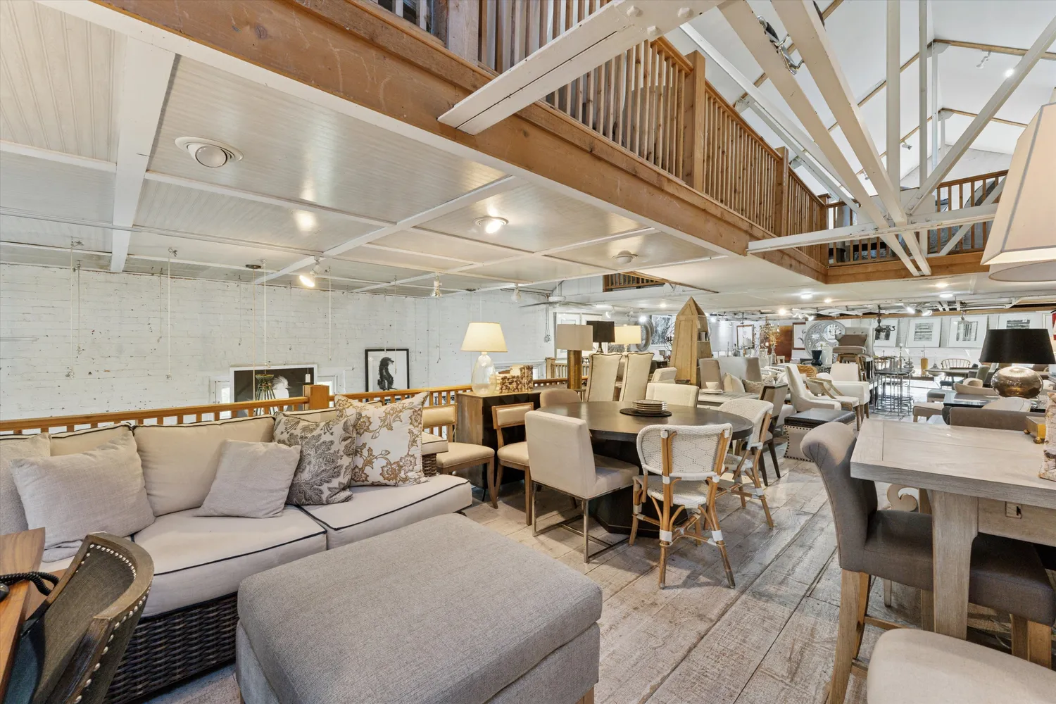 a living room with lots of furniture and a chandelier
