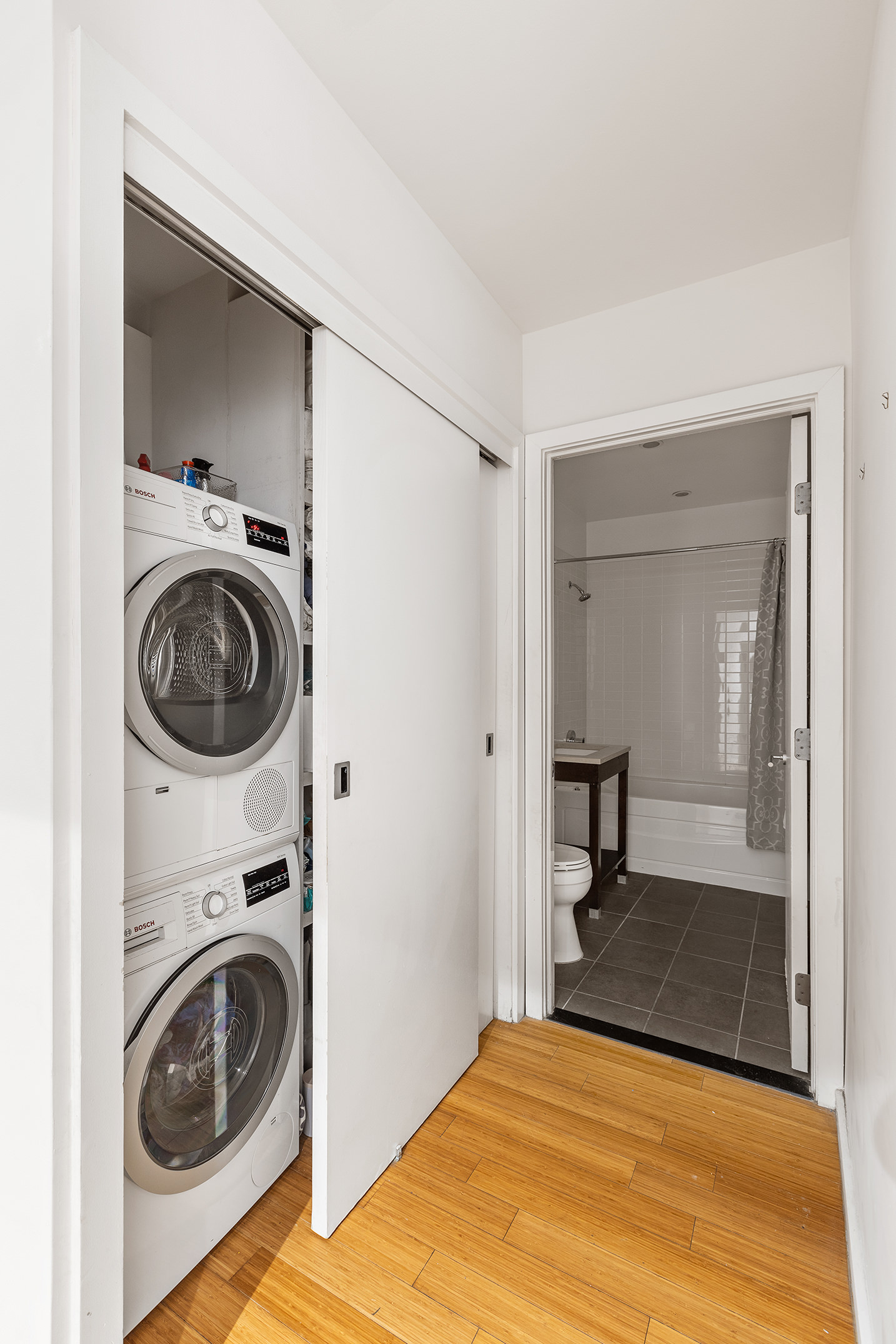 365 Bridge Street, Unit 8I Brooklyn, NY 11201 - Photo 8 of 10 a view of a bedroom with washer and dryer