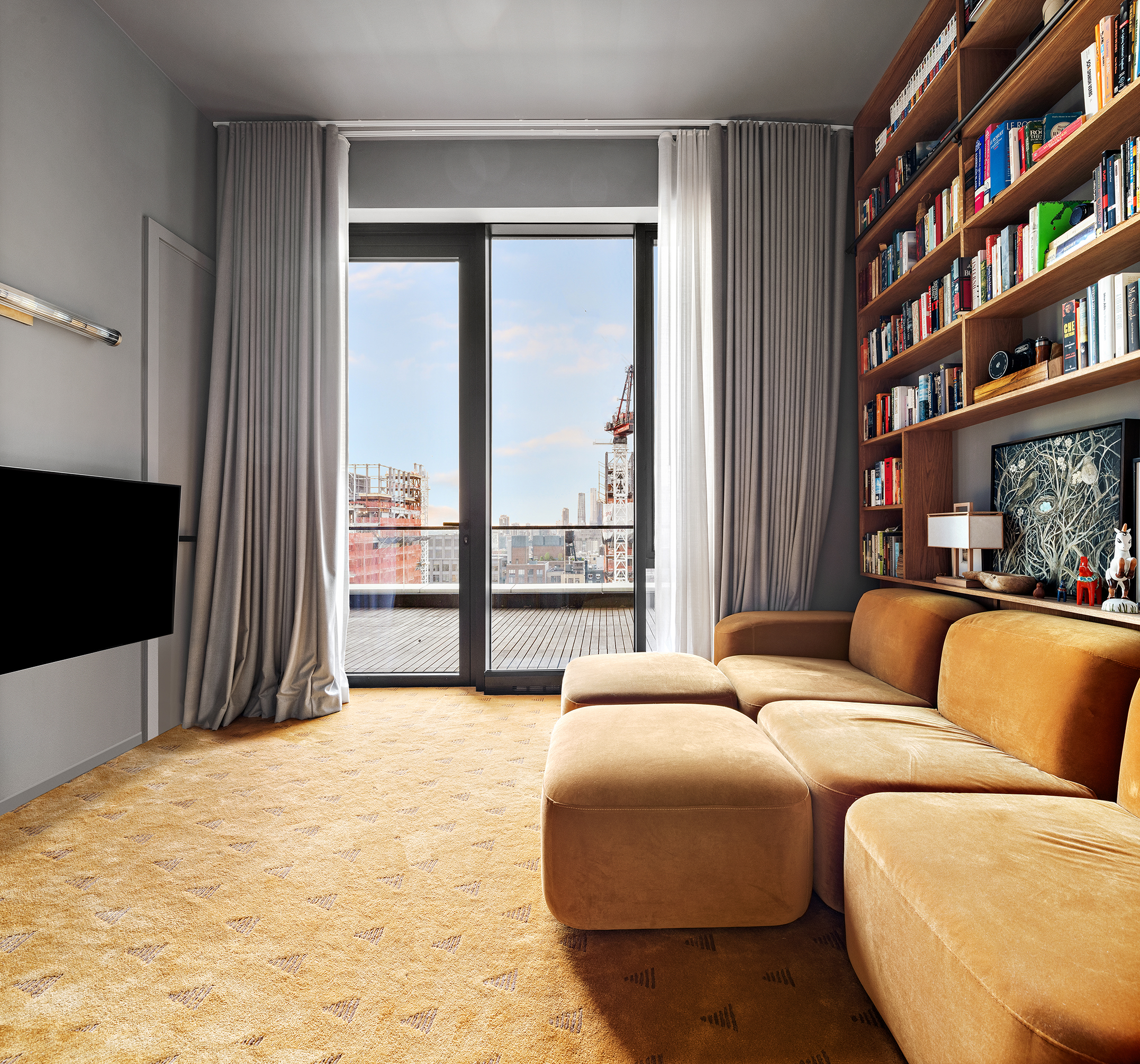 570 Broome Street, Unit PHA Manhattan, NY 10013 - Photo 15 of 22 a bedroom with a bed a large window and a flat screen tv