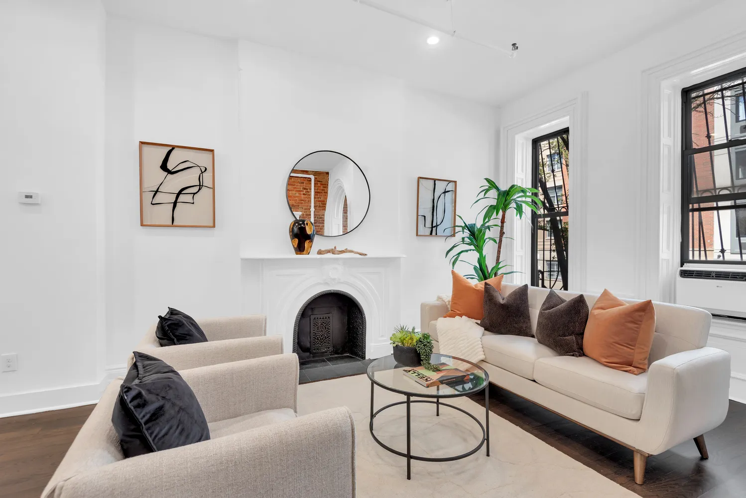 a living room with furniture a rug and a fireplace