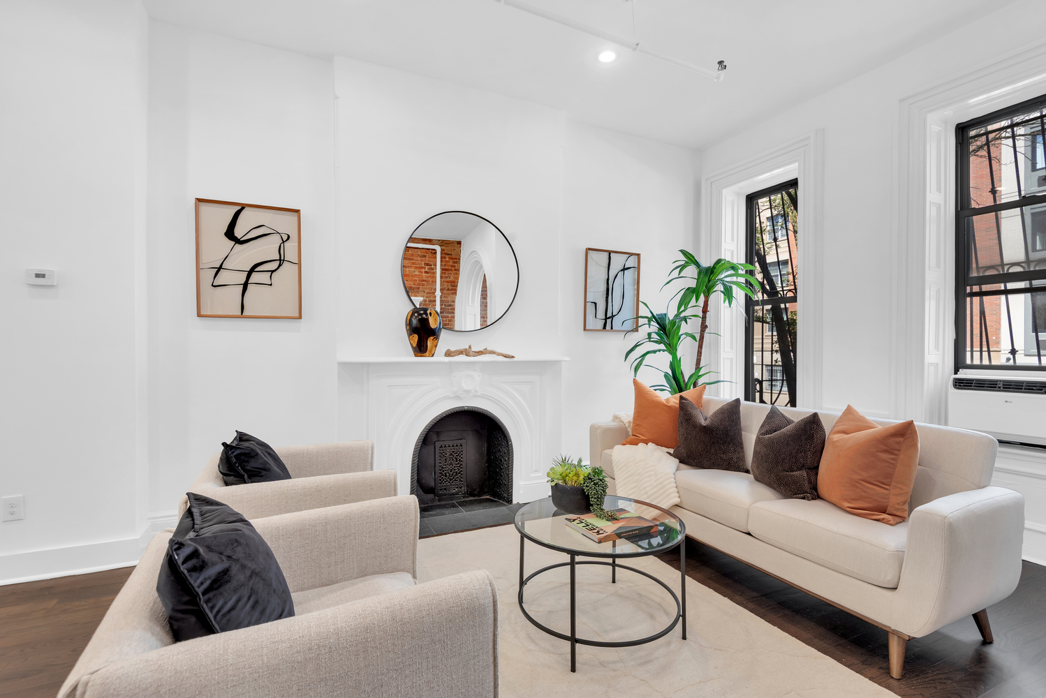 a living room with furniture a rug and a fireplace