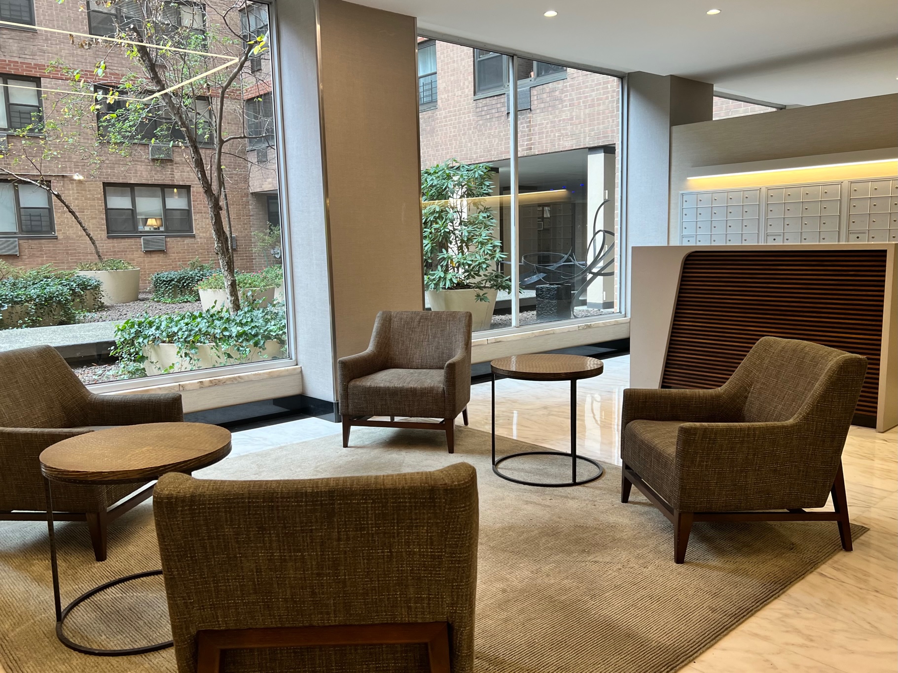 333 East 79th Street, Unit 9Y Manhattan, NY 10075 - Photo 9 of 11 a living room with furniture and a fireplace