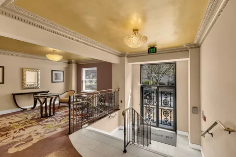 a view of a livingroom with furniture and window