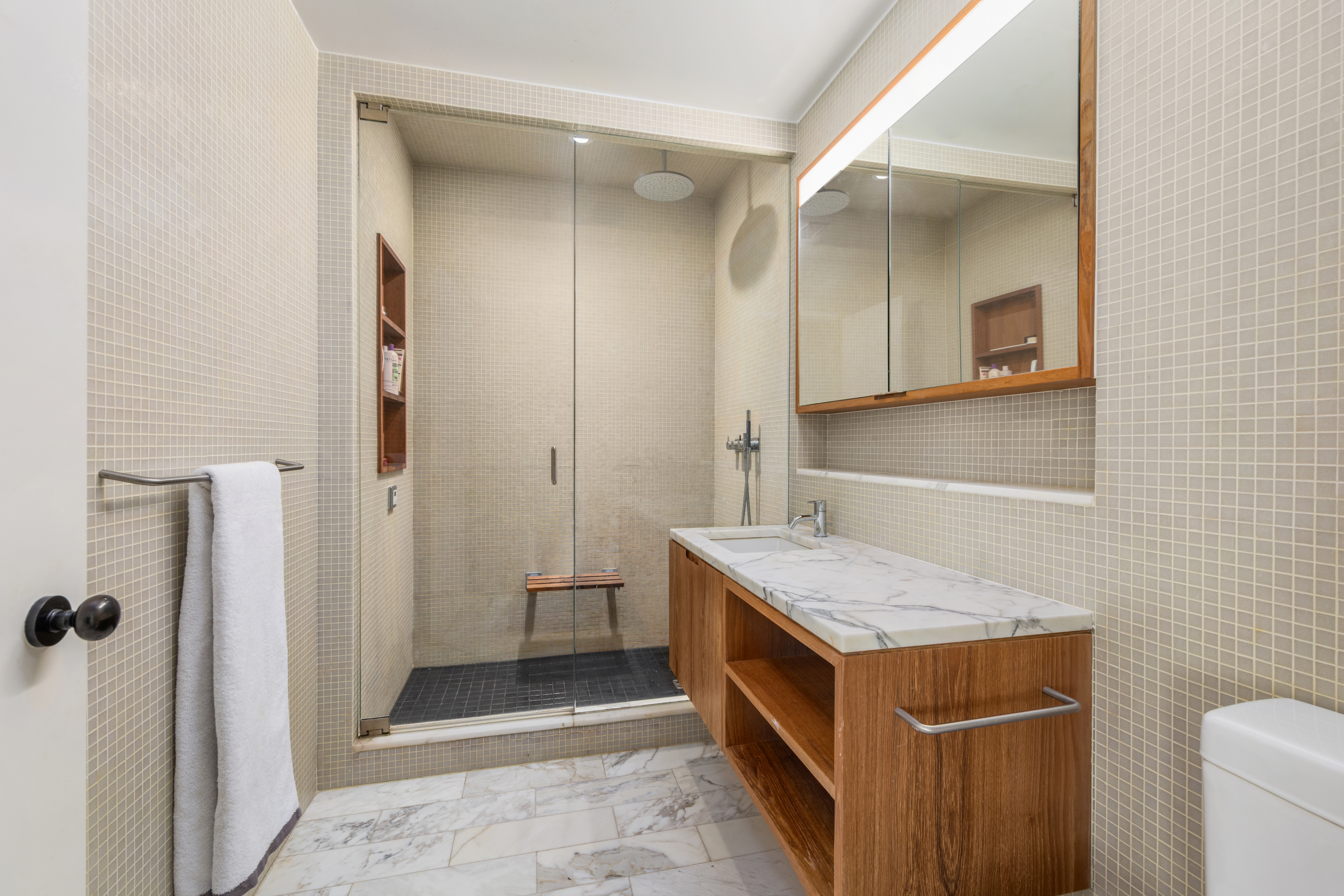 456 West 19th Street, Unit 4/5A Manhattan, NY 10011 - Photo 12 of 15 a bathroom with a granite countertop sink and a mirror