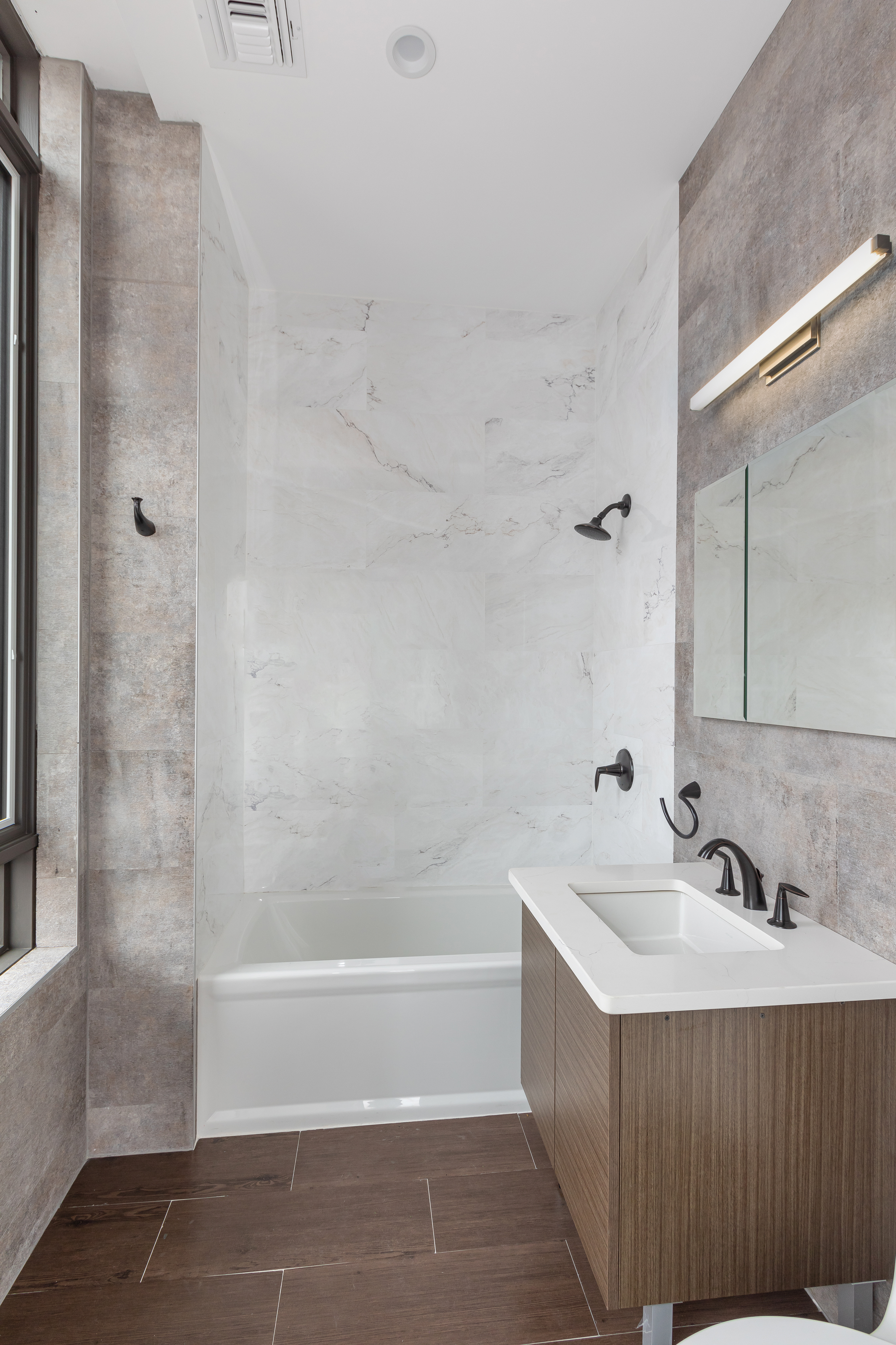 47-16 Greenpoint Avenue, Unit 3A Queens, NY 11104 - Photo 4 of 9 a bathroom with a bathtub and a sink