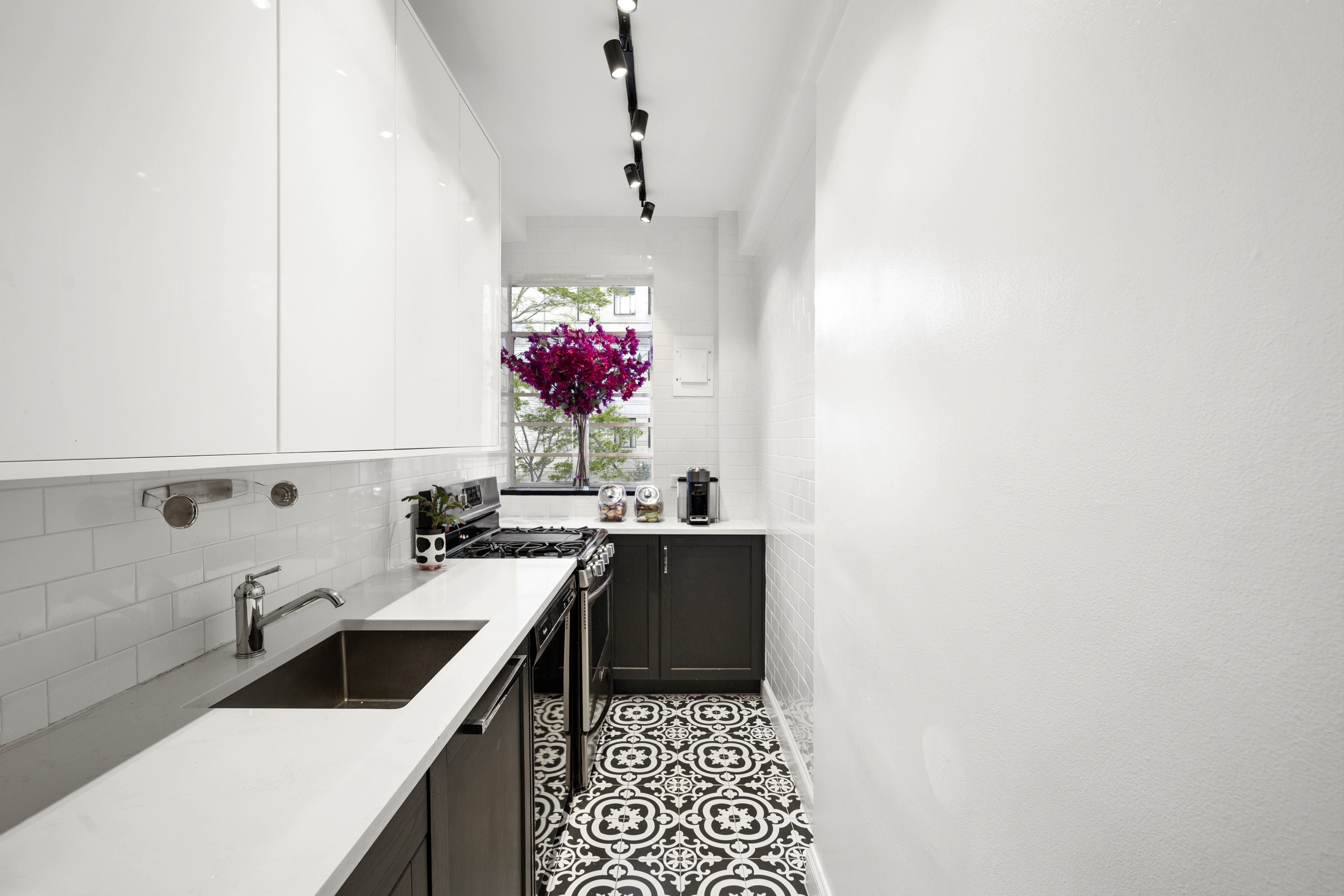 140 Riverside Drive, Unit 1G Manhattan, NY 10024 - Photo 9 of 16 a kitchen with a sink and cabinets