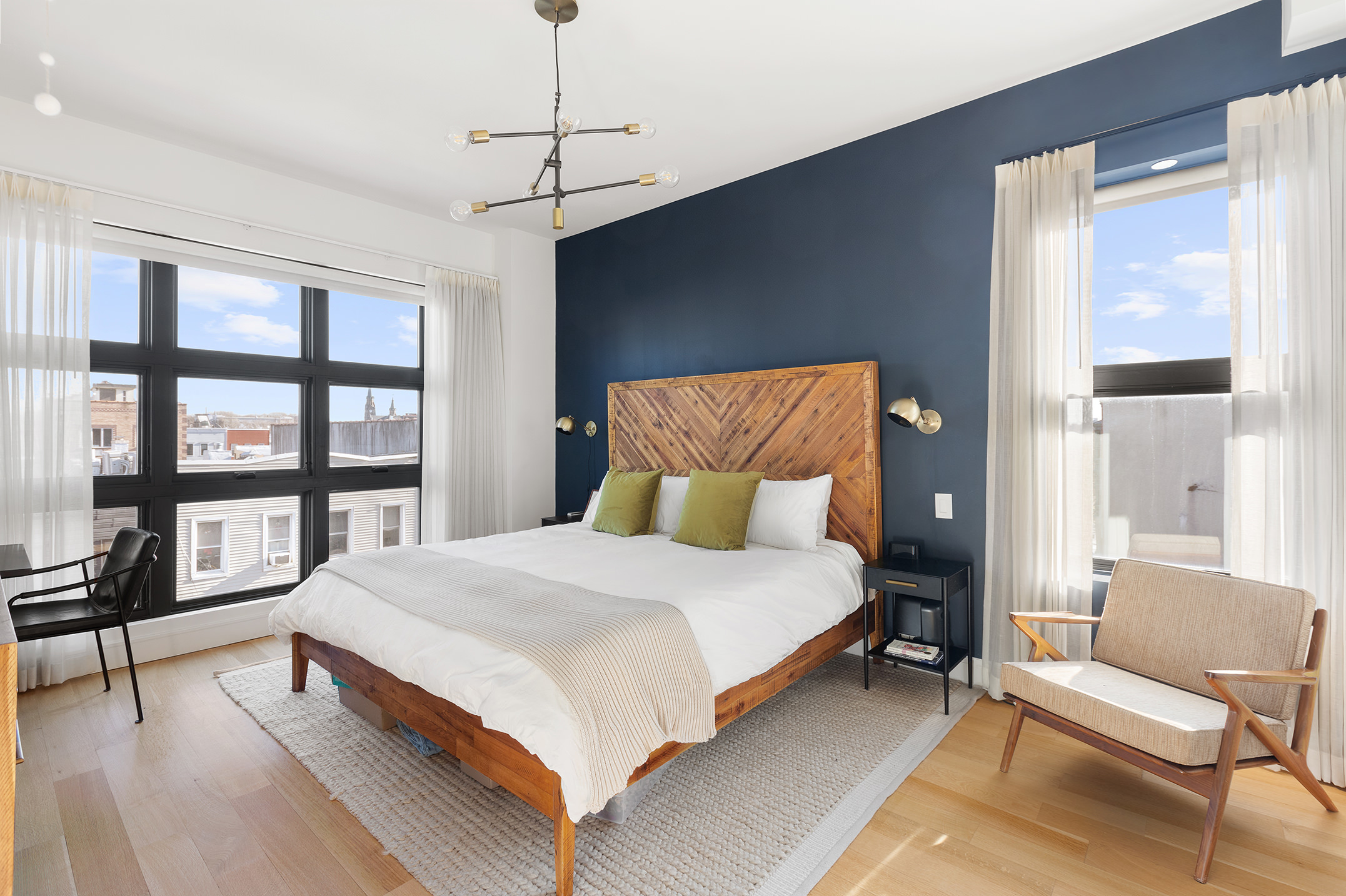 868 Lorimer Street, Unit 4C Brooklyn, NY 11222 - Photo 5 of 14 a bedroom with a large bed and a balcony view