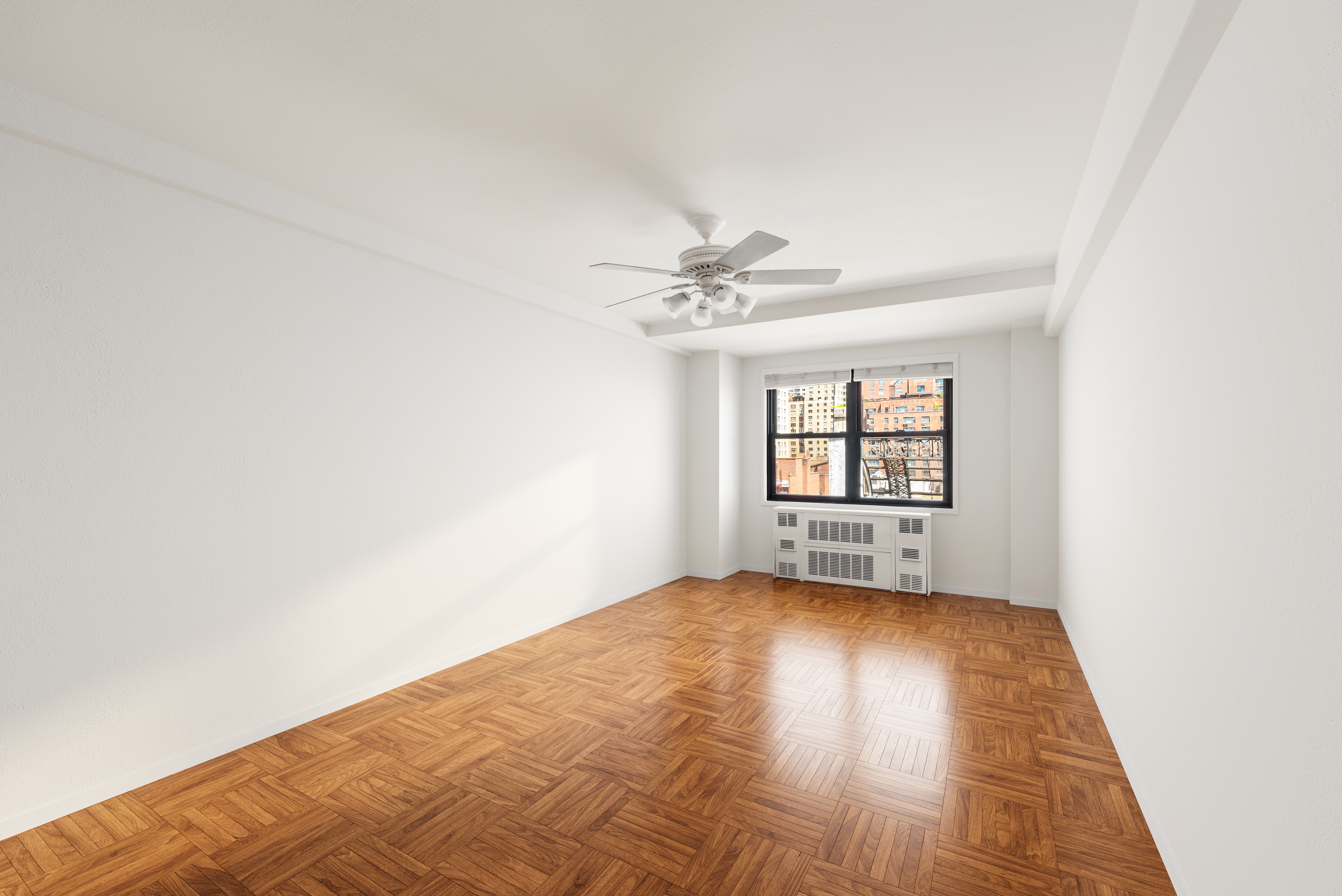 347 East 53rd Street, Unit 9C Manhattan, NY 10022 - Photo 4 of 10 a view of an empty room and window