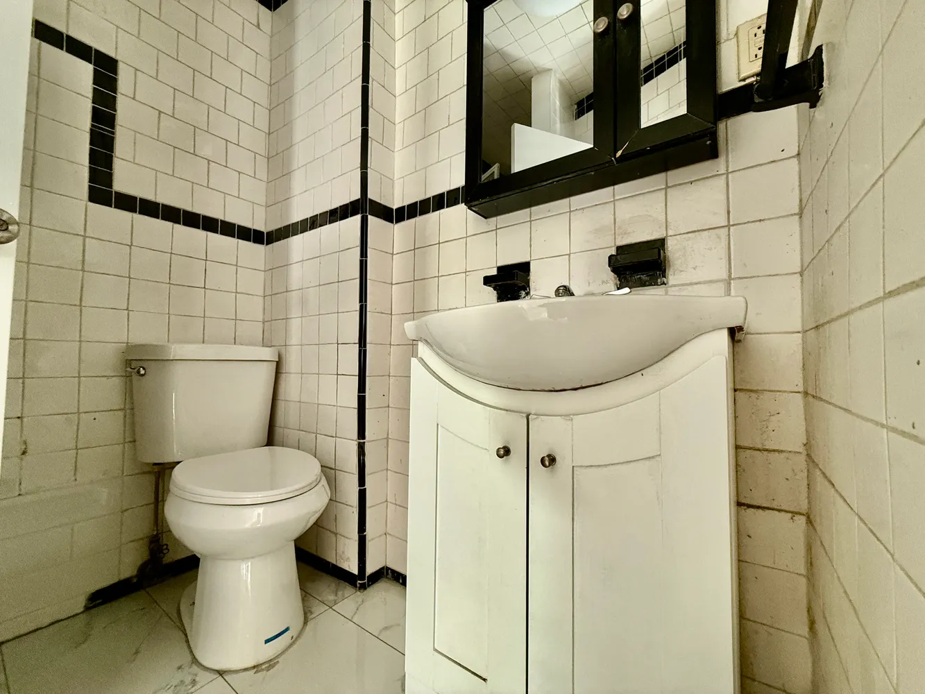 a bathroom with a toilet and a sink