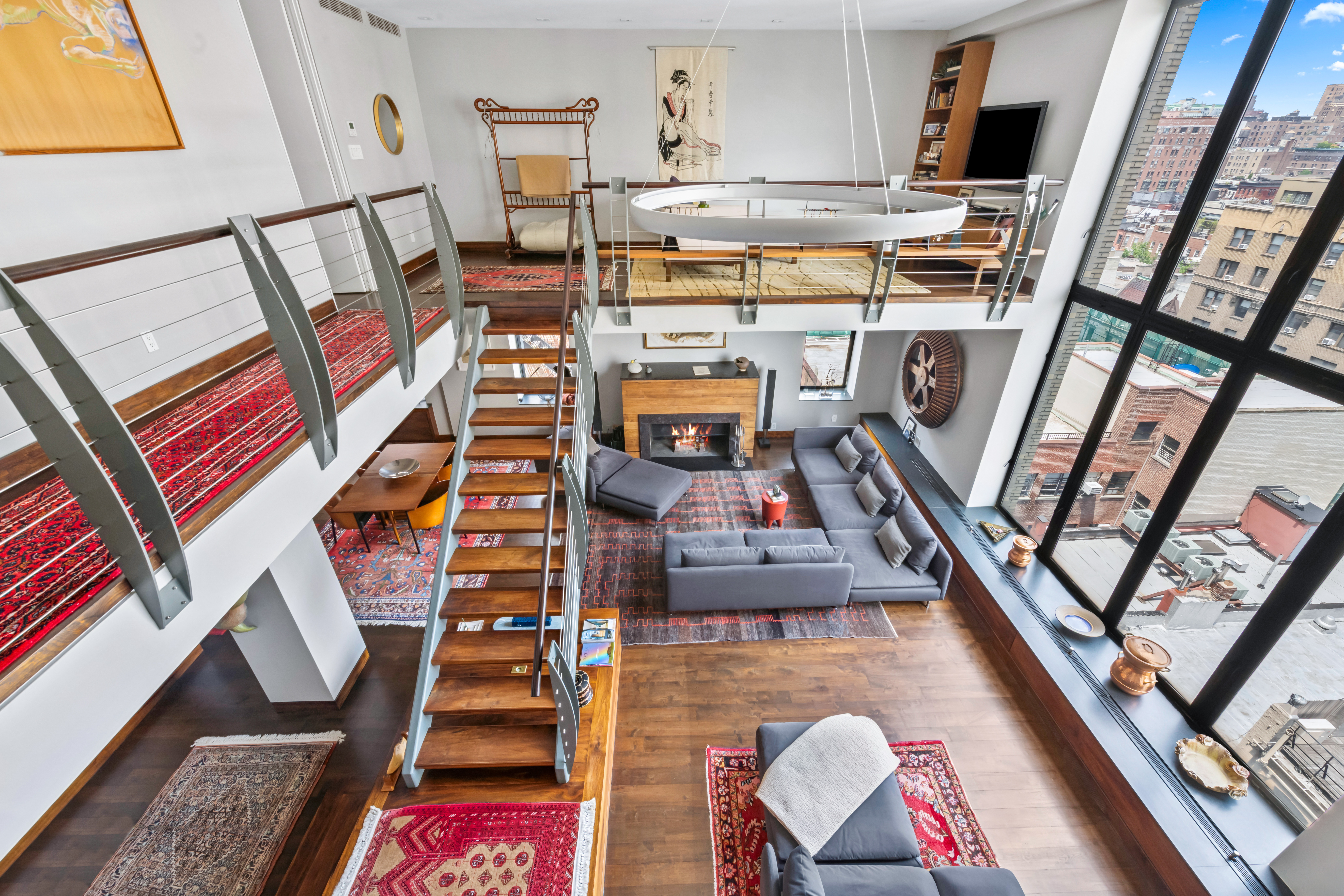 1 West 67th Street, Unit 707 Manhattan, NY 10023 - Photo 8 of 21 a view of a living room with furniture and a fireplace