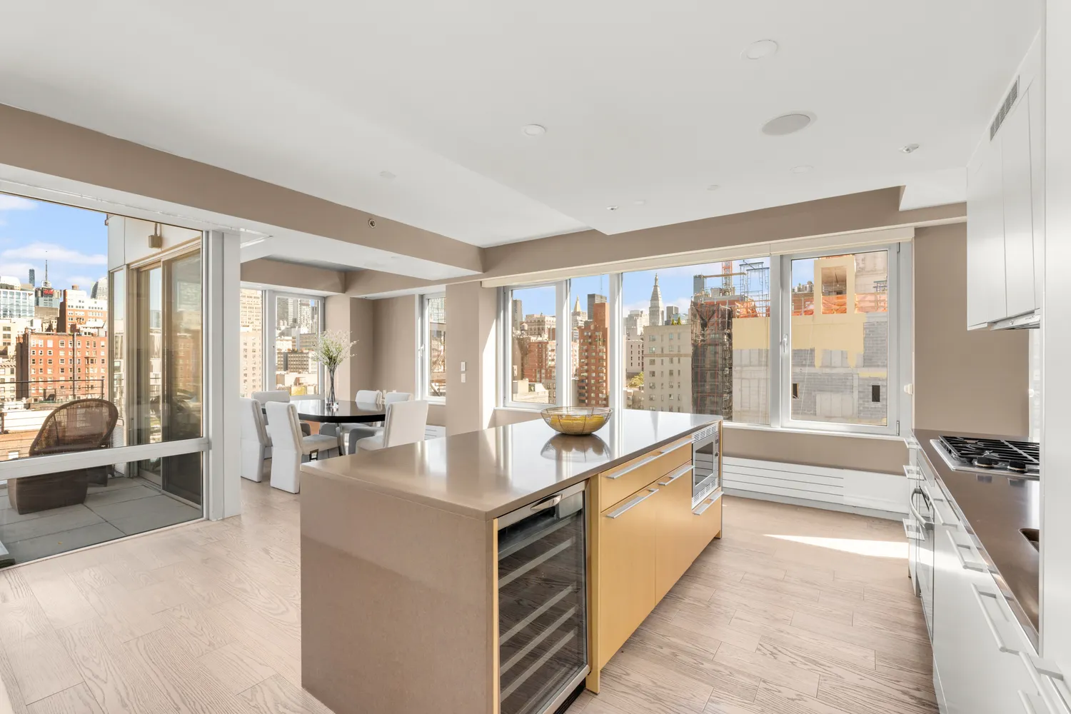 a large white room with a large window and a view of living room