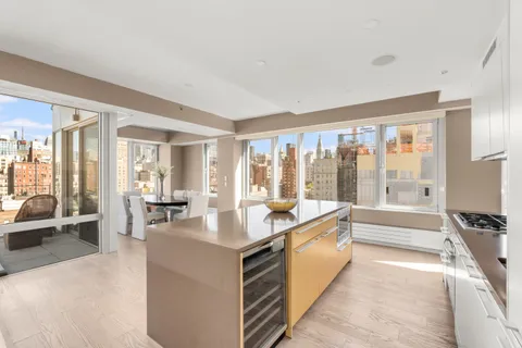 a large white room with a large window and a view of living room