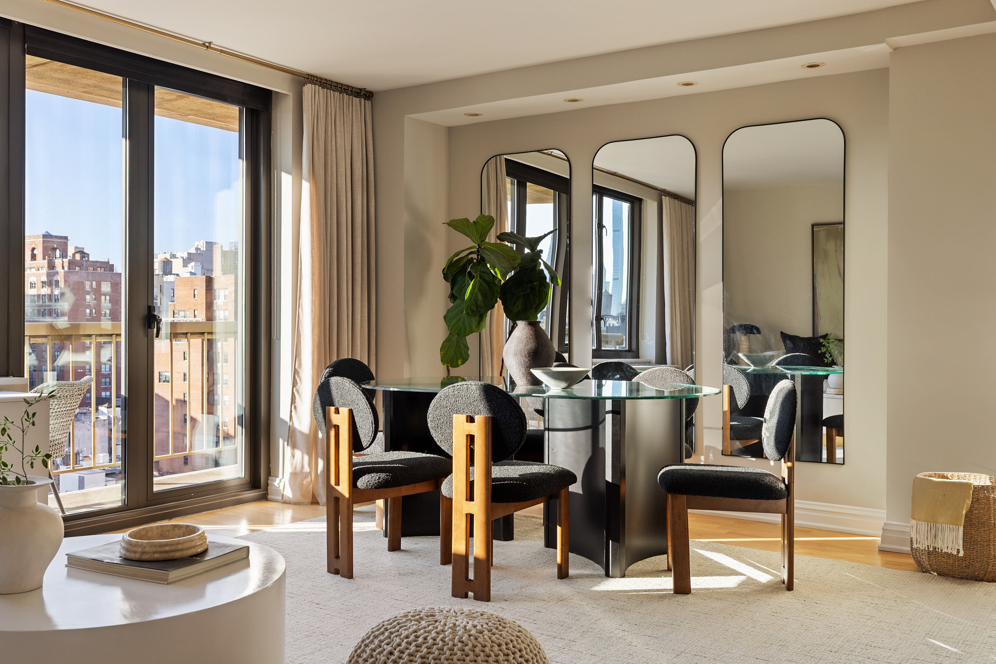 1438 3rd Avenue, Unit 15B Manhattan, NY 10028 - Photo 3 of 21 a living room with furniture and a large window