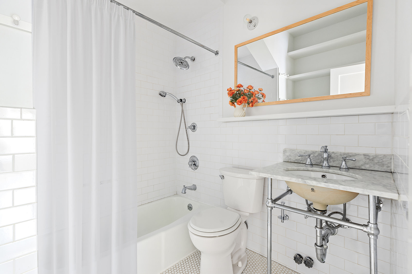 482 12th Street, Unit 1 Brooklyn, NY 11215 - Photo 6 of 10 a bathroom with a sink a toilet and shower