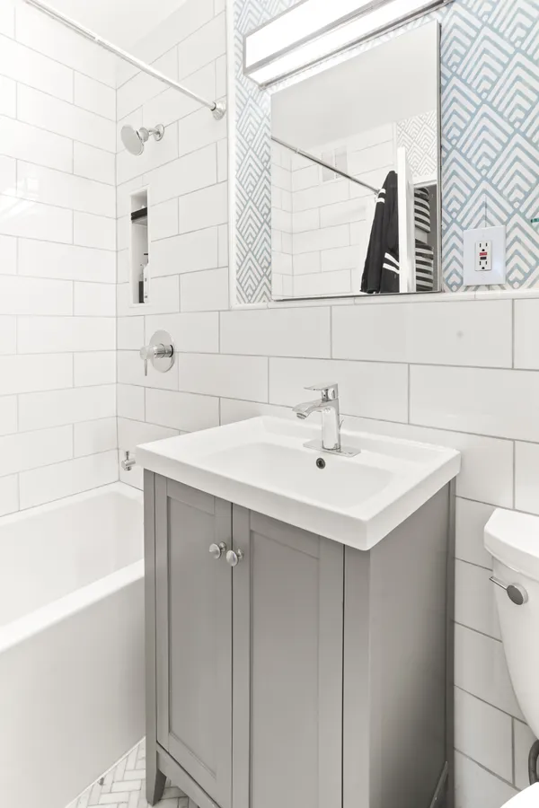 a bathroom with a sink and a bathtub
