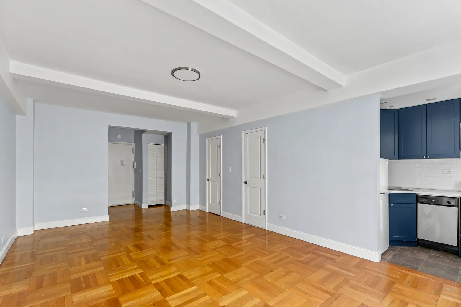 a view of a livingroom with a & kitchen stove