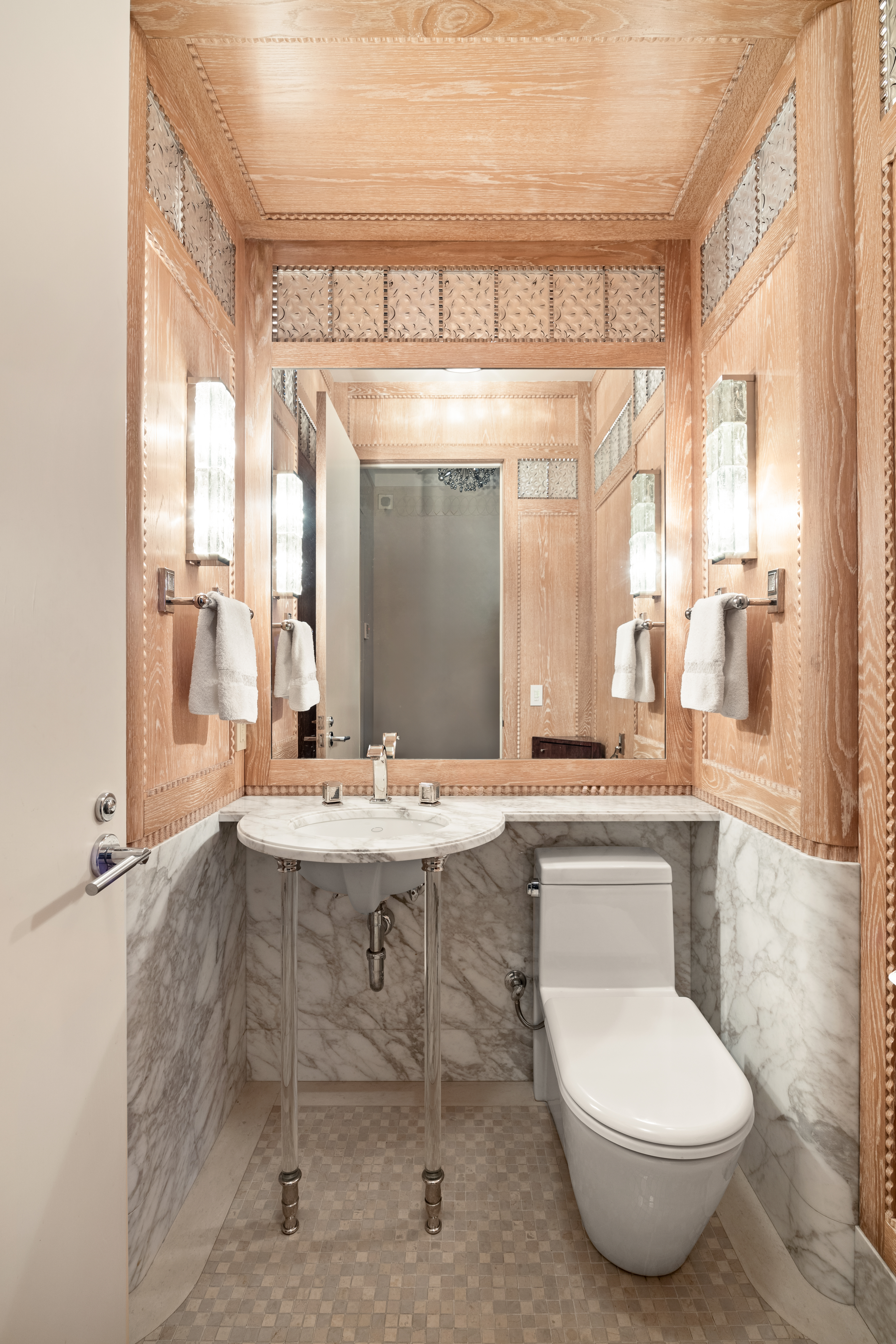 25 Columbus Circle, Unit 75A Manhattan, NY 10019 - Photo 20 of 36 a bathroom with a toilet sink and mirror