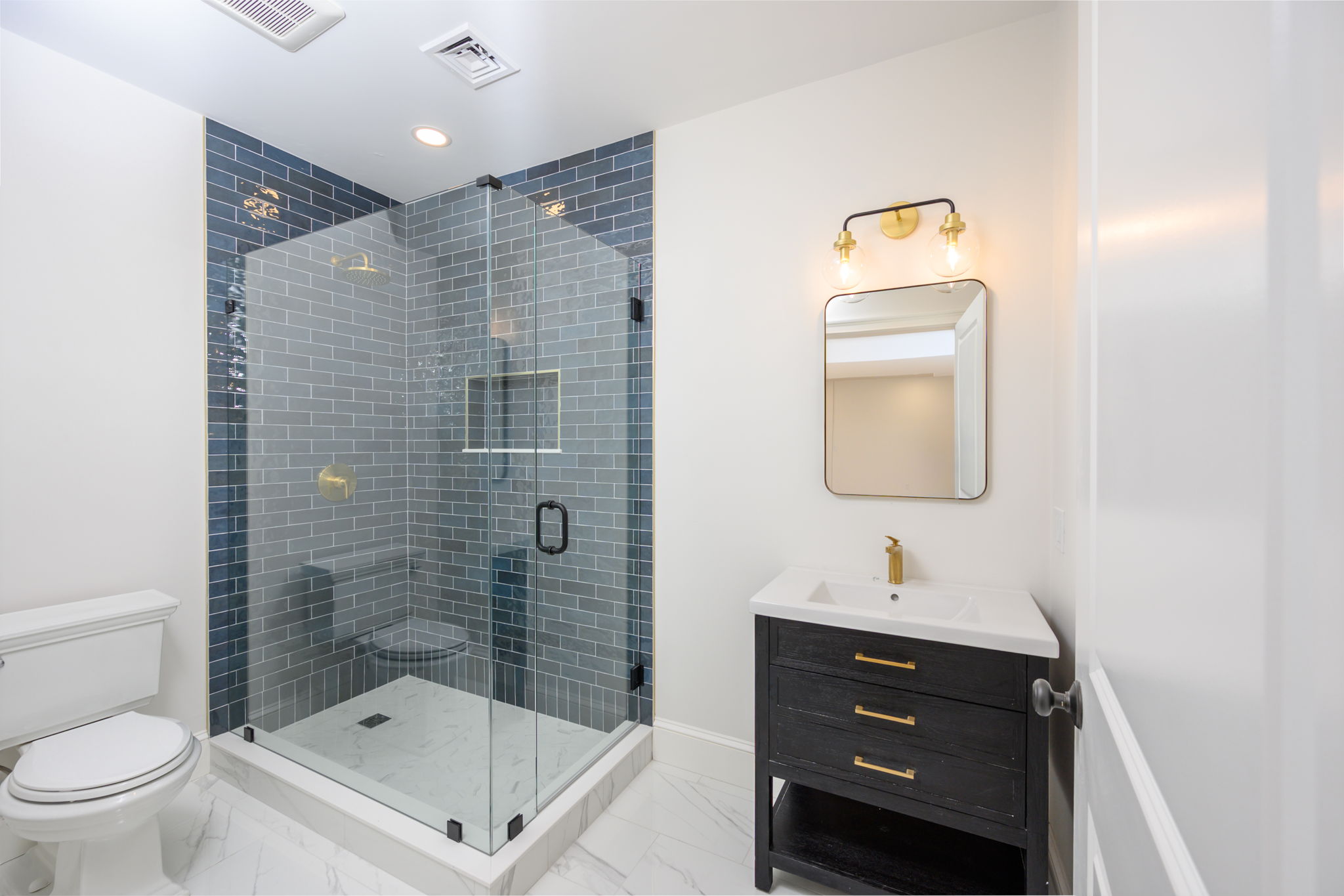 249 Central Avenue Milton, MA 02186 - Photo 43 of 61 a bathroom with a sink a toilet and shower