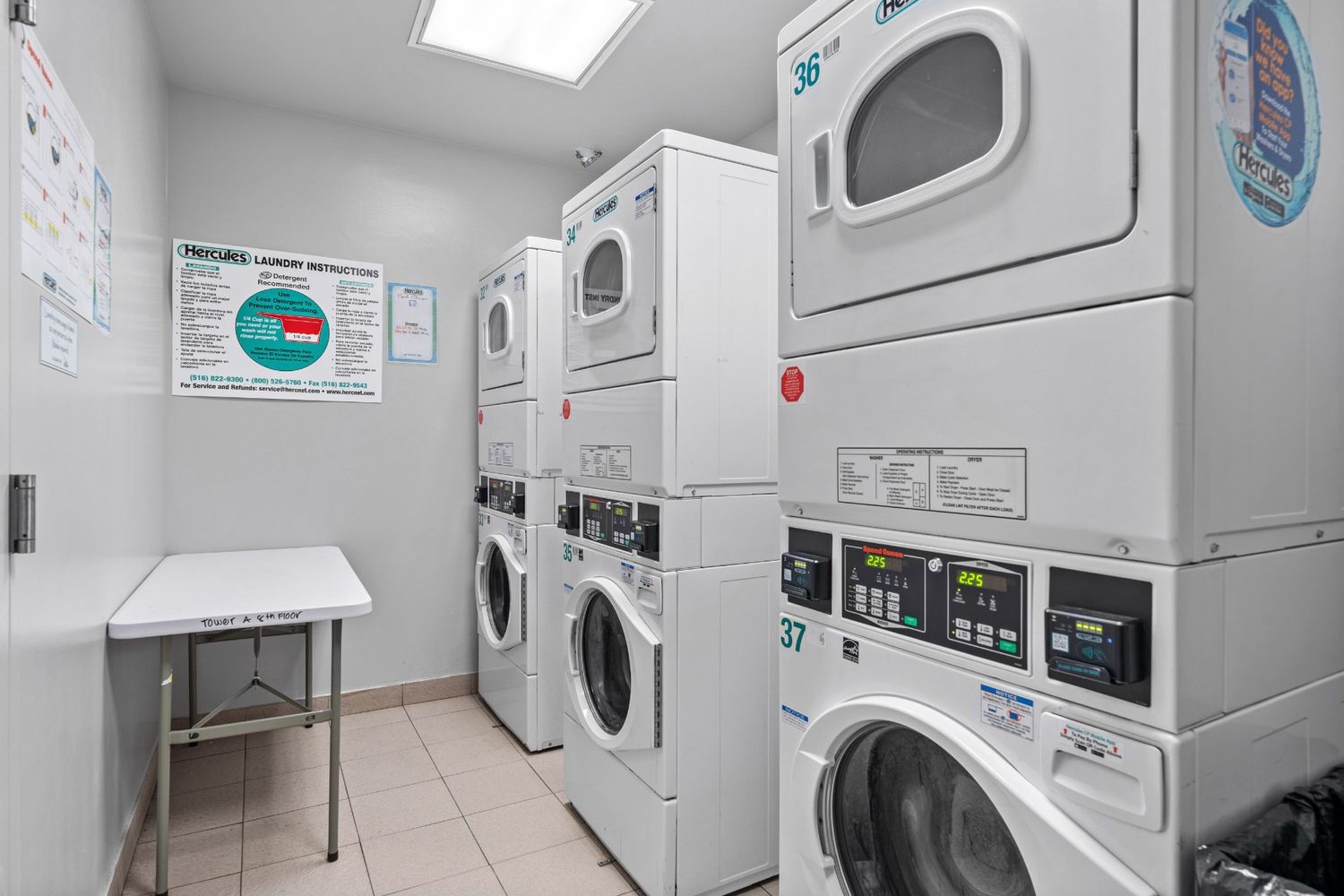 40 West 116th Street, Unit B503 Manhattan, NY 10026 - Photo 30 of 36 a utility room with dryer and washer