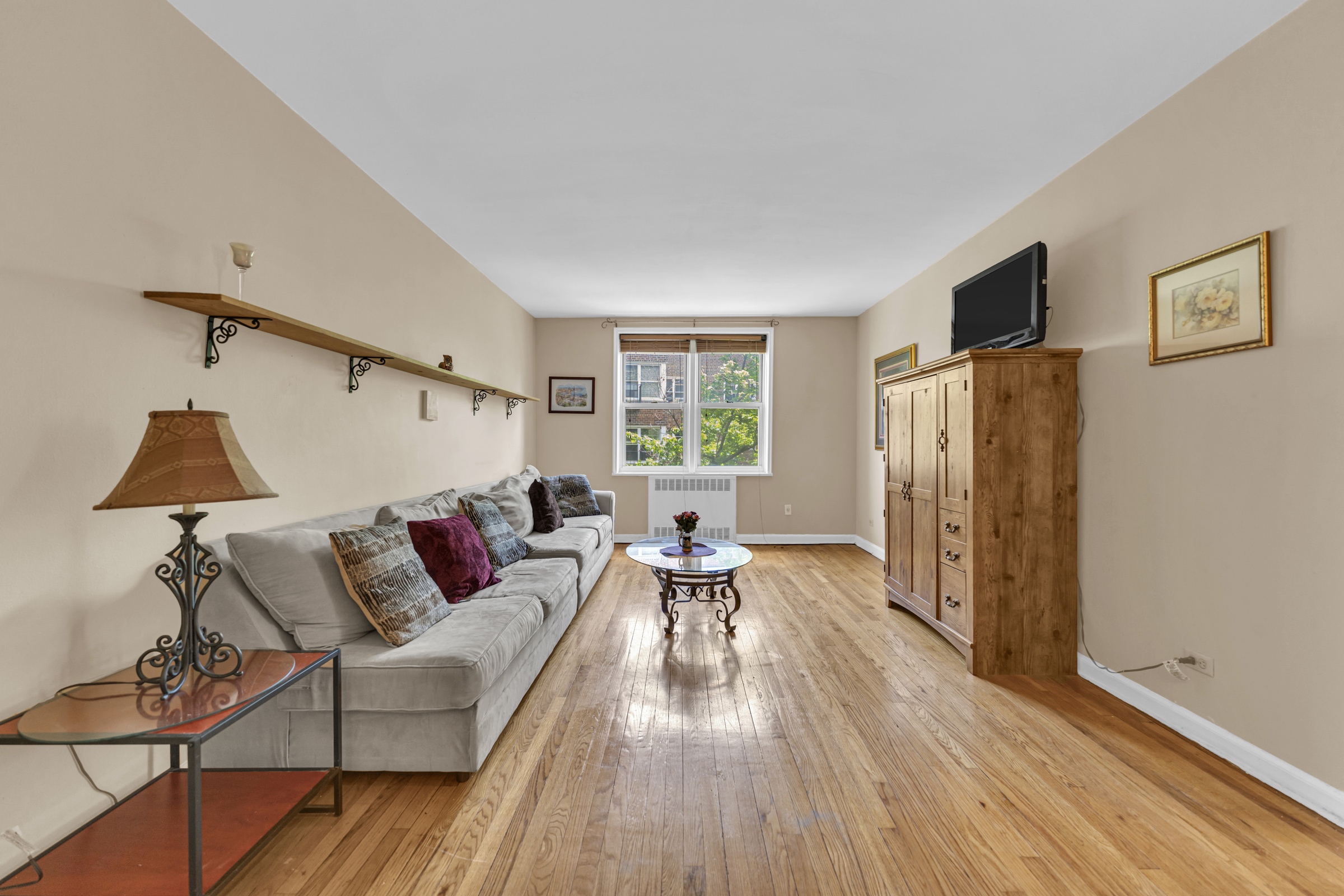 5614 Netherland Avenue, Unit 3E Bronx, NY 10471 - Photo 3 of 13 a living room with furniture and a window