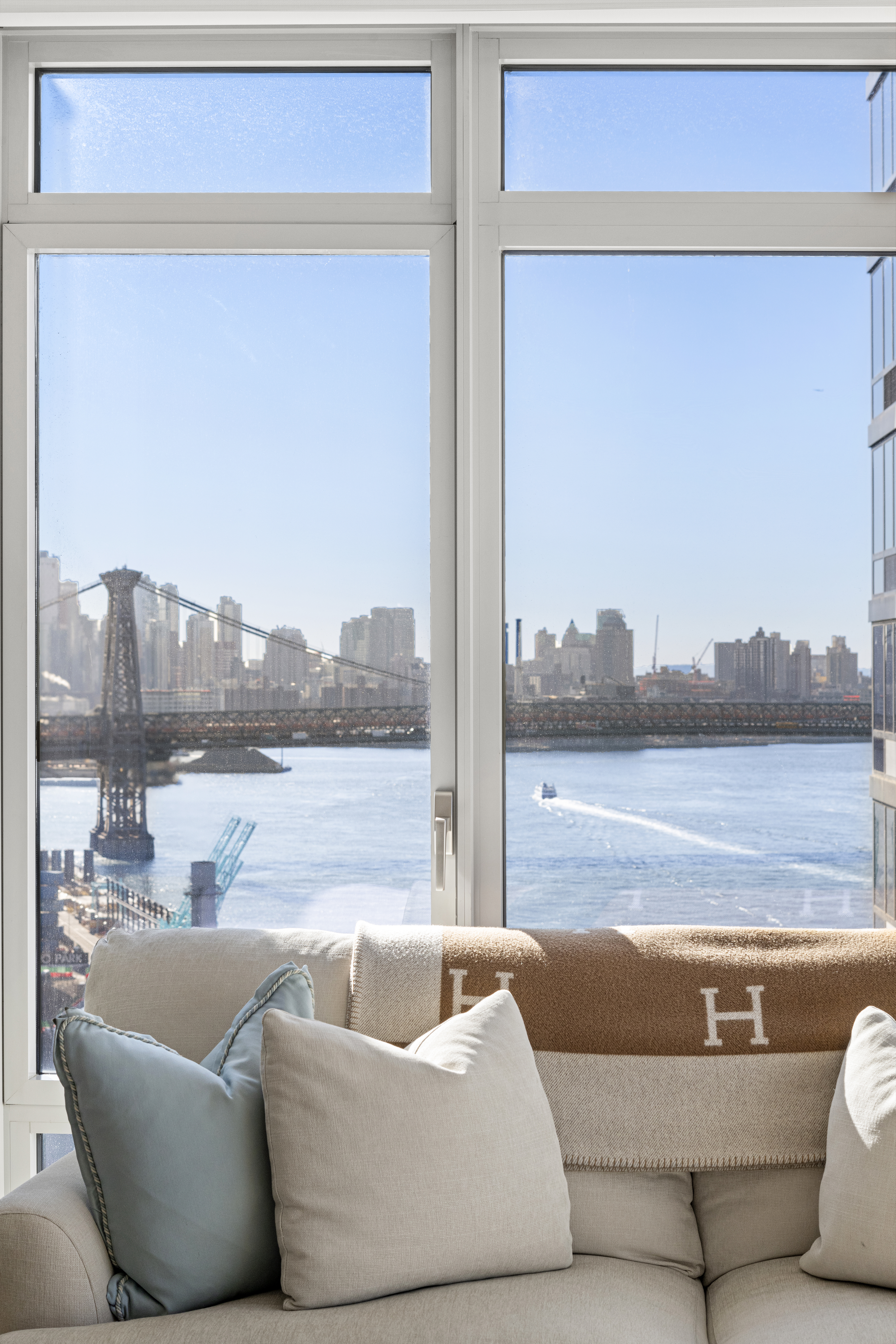 2 Northside Piers, Unit 17A Brooklyn, NY 11249 - Photo 7 of 21 a living room with furniture and a large window