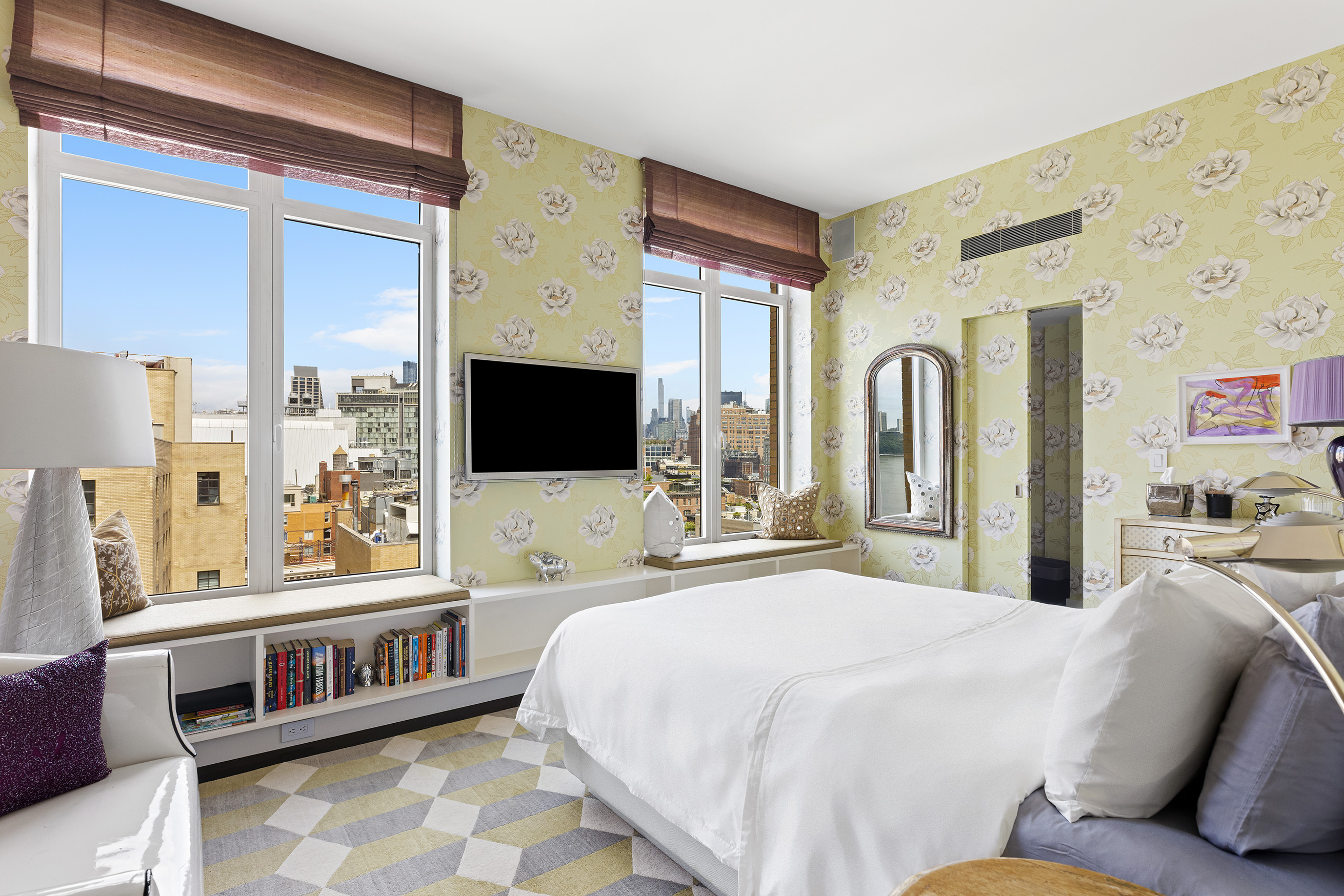 400 West 12th Street, Unit 12C Manhattan, NY 10014 - Photo 17 of 24 a bedroom with a large bed and a flat tv screen on dresser