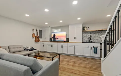 a kitchen with stainless steel appliances granite countertop a sink and cabinets