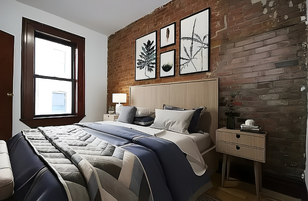 24 East 97th Street, Unit 22 Manhattan, NY 10128 - Photo 3 of 4 a bedroom with a bed and a window