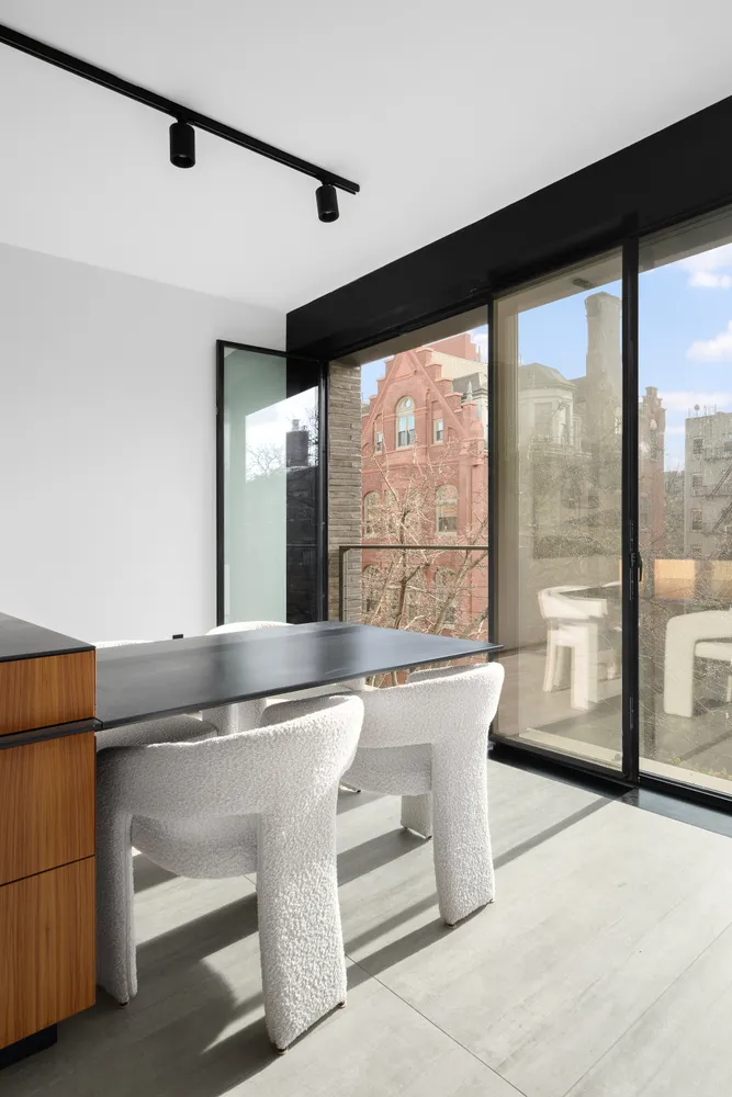 a living room with granite countertop furniture and a large window