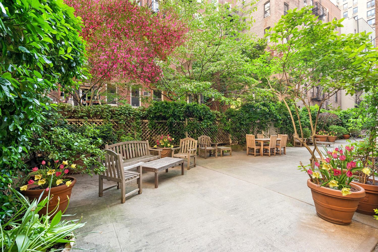 316 West 84th Street, Unit 6B Manhattan, NY 10024 - Photo 6 of 10 a view of a patio with a chairs and potted plants