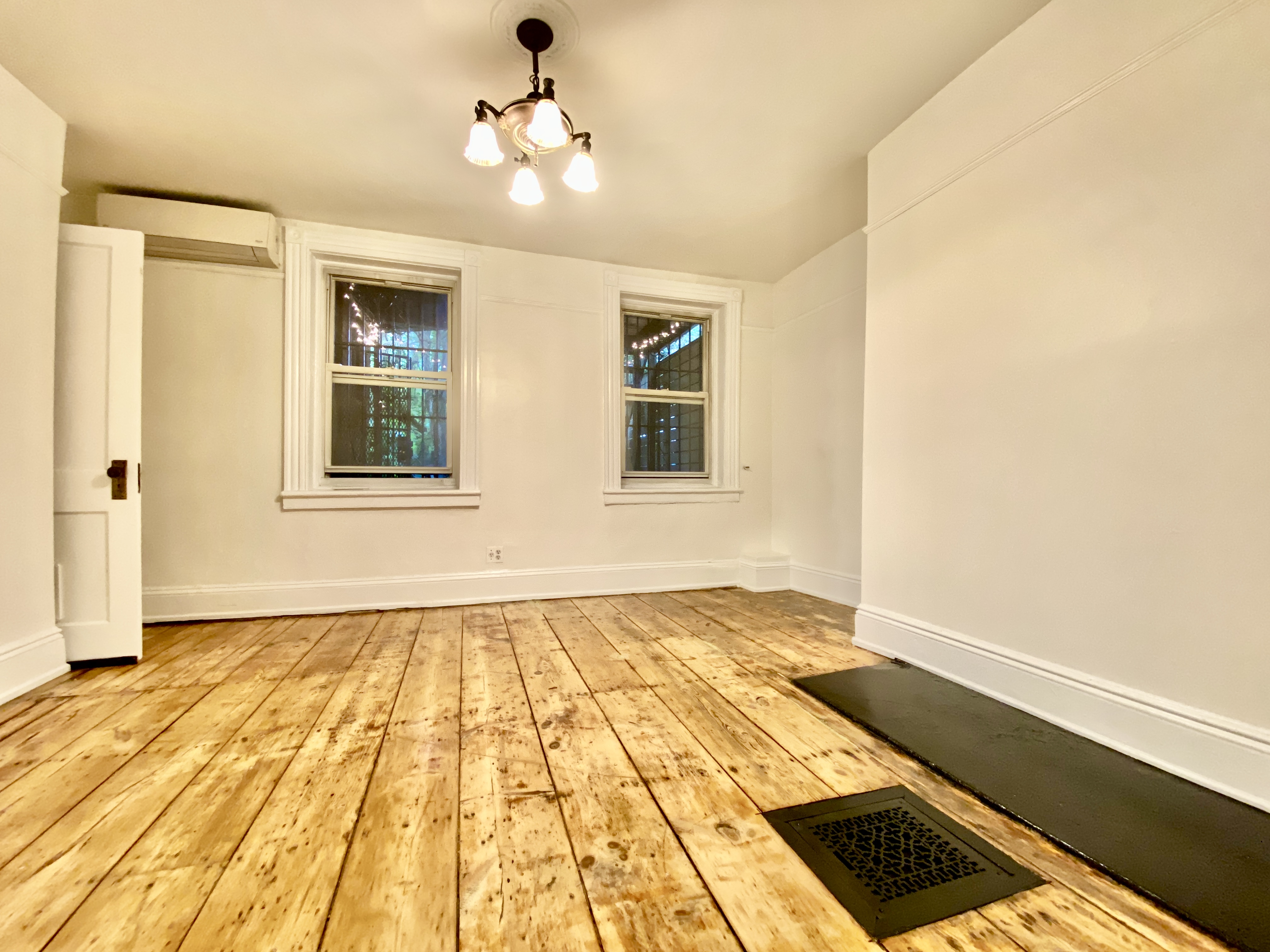 119 Gates Avenue, Unit 1 Brooklyn, NY 11238 - Photo 4 of 11 a view of an empty room with a window