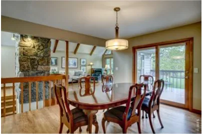 a bedroom with a bed a mirror and lamp