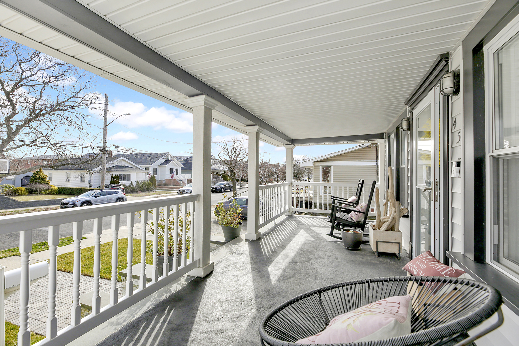 4-53 Beach 142nd Street Queens, NY 11694 - Photo 4 of 39 a living room with furniture floor to ceiling window and wooden floor