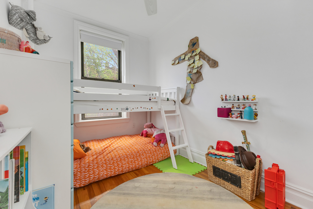 74 2nd Place, Unit 2B Brooklyn, NY 11231 - Photo 8 of 14 a bedroom with a bed and a chandelier