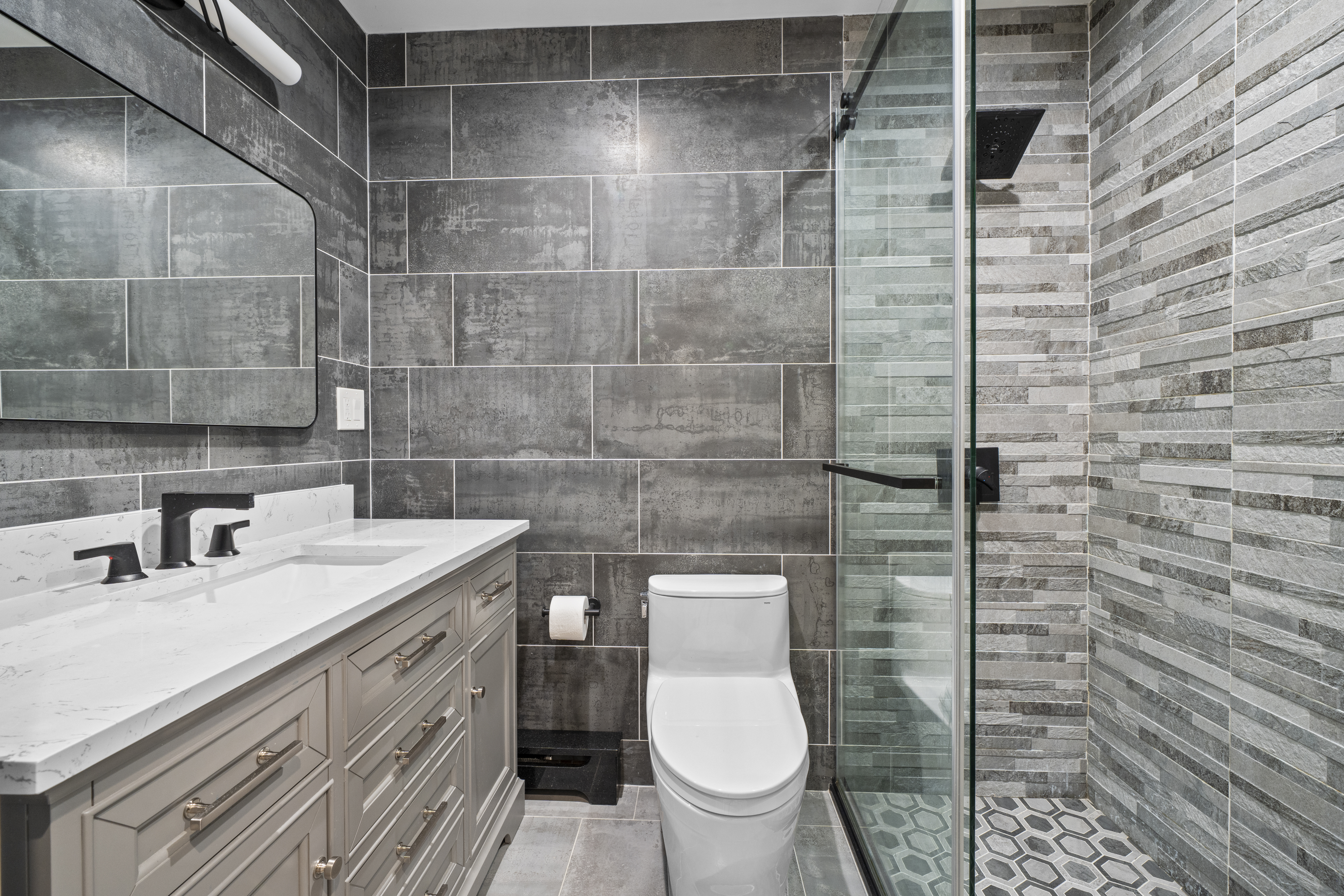 2253 East 64th Street Brooklyn, NY 11234 - Photo 24 of 45 a bathroom with a sink toilet and shower