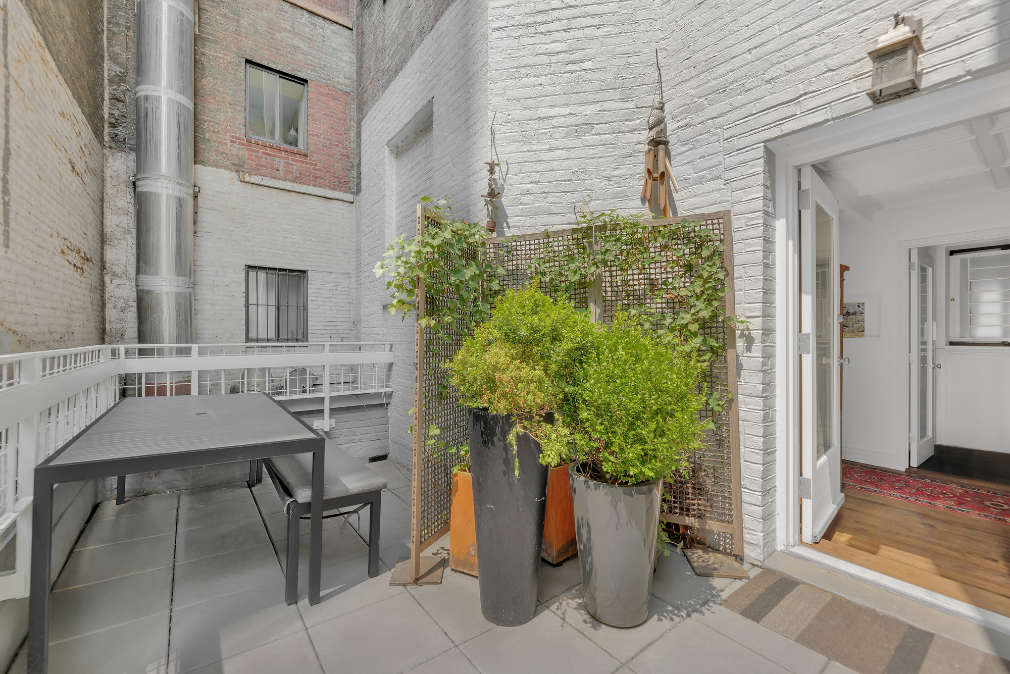 330 West End Avenue, Unit 2B Manhattan, NY 10023 - Photo 5 of 14 a potted plant sitting in front of a house