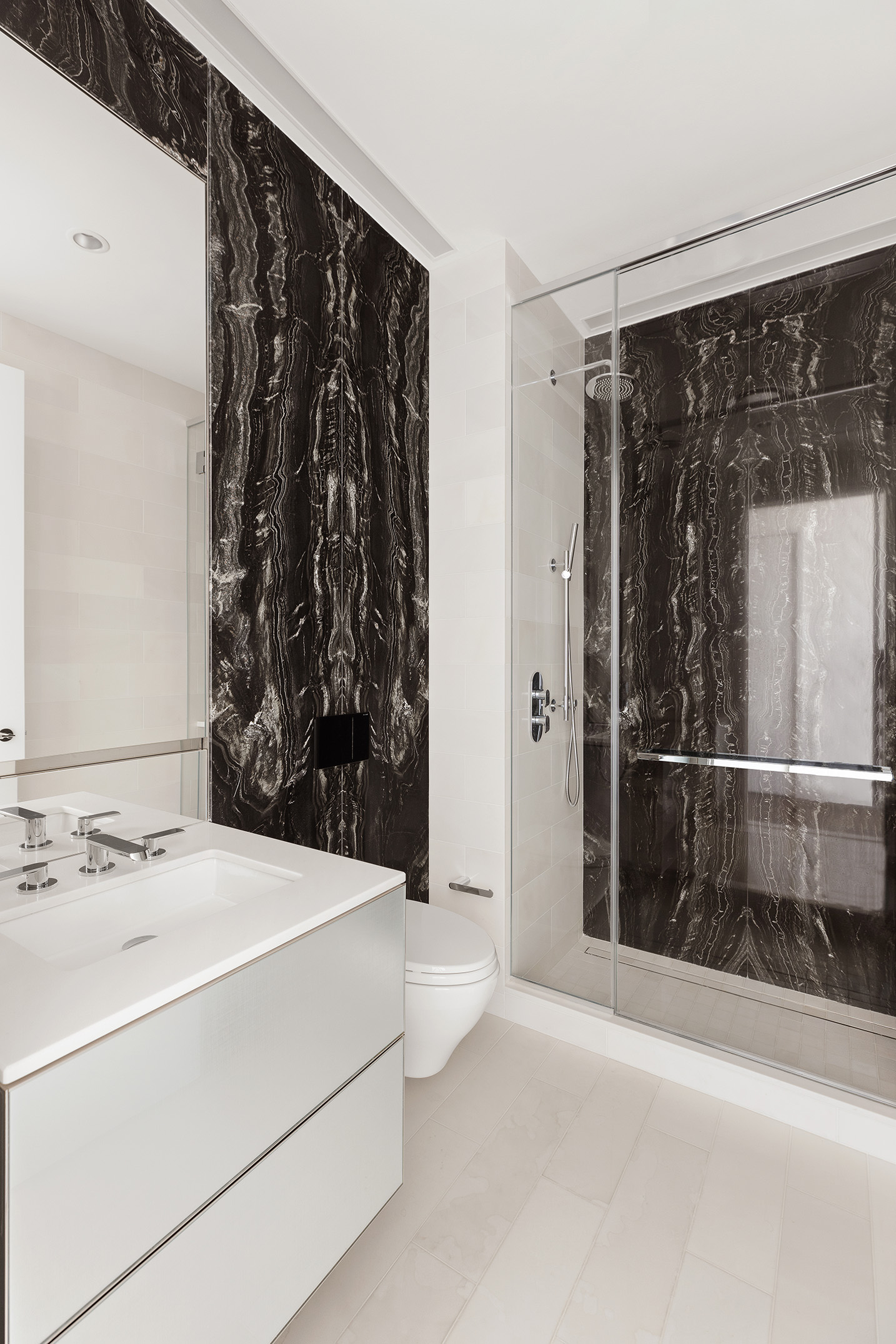 217 West 57th Street, Unit 60W Manhattan, NY 10019 - Photo 10 of 27 a bathroom with a bathtub and shower