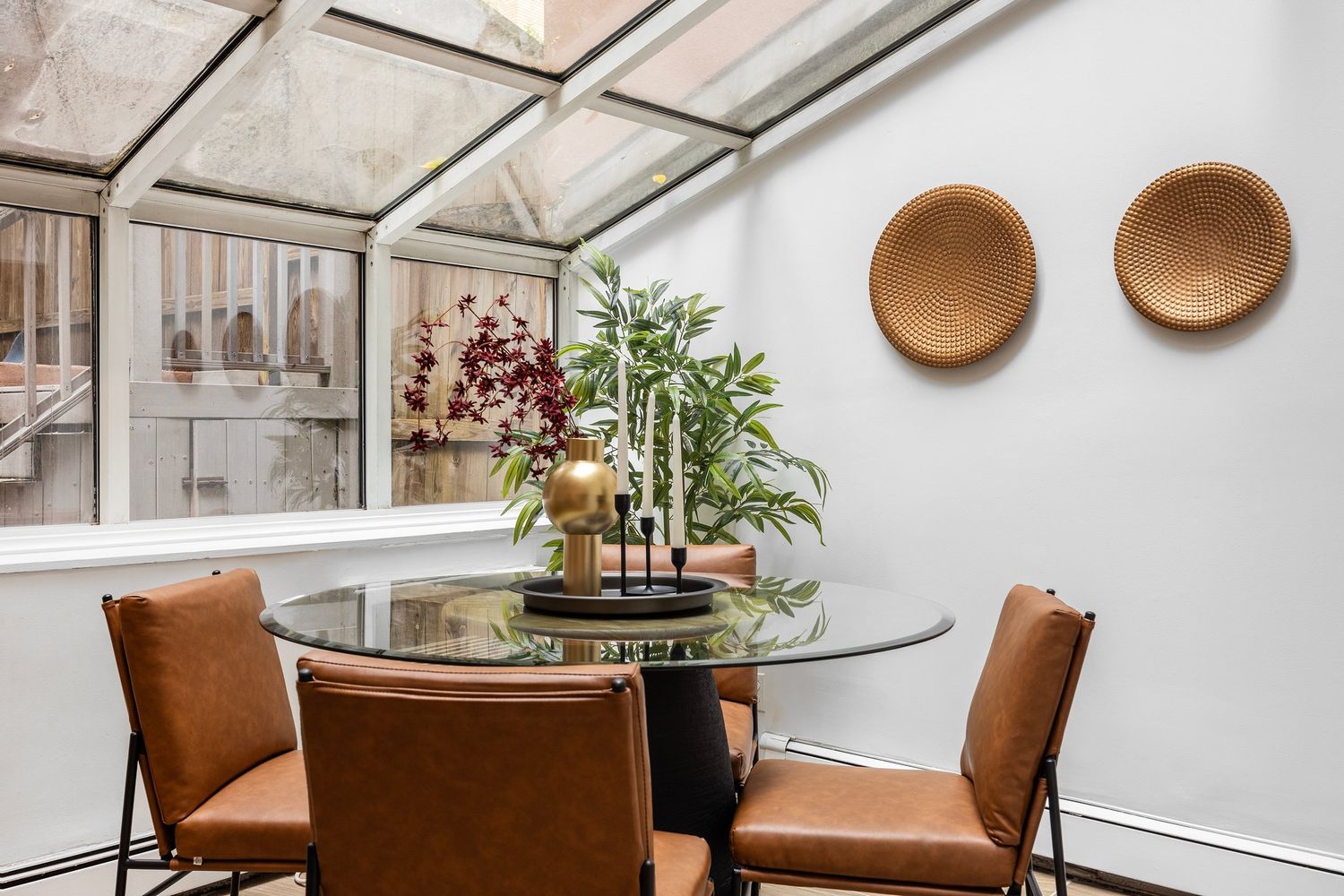 261 West 71st Street, Unit 1 Manhattan, NY 10023 - Photo 4 of 15 a table and chairs in a blue pot